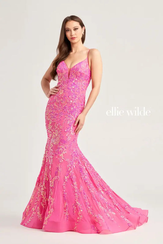 This Ellie Wilde EW35048 prom dress features a long, sheer bodice and stunning sequin detailing. The mermaid silhouette and plunging V-neckline create a flattering and glamorous look. Perfect for a formal event, this dress will make you stand out from the crowd.  Sizes: 00-16  Colors: Ice Blue, Hot Pink, Lavender, Navy Blue, Black