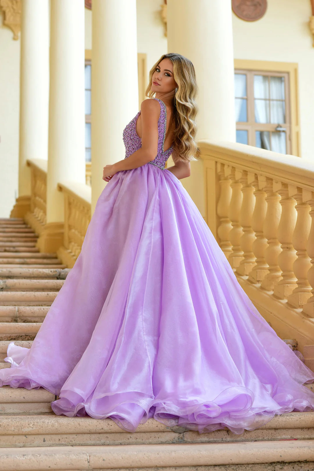 The Ava Presley 38342 A Line Beaded V Neck Ballgown is the perfect choice for your next pageant, prom, or formal event. With stunning beaded detailing and a flattering A line silhouette, this gown will turn heads and make you feel like a true queen. The V neck adds an elegant touch, while the train adds a touch of drama. Make a statement with this gorgeous dress.  Sizes: 00-16  Colors: Lilac, White, Ice Blue, Periwinkle