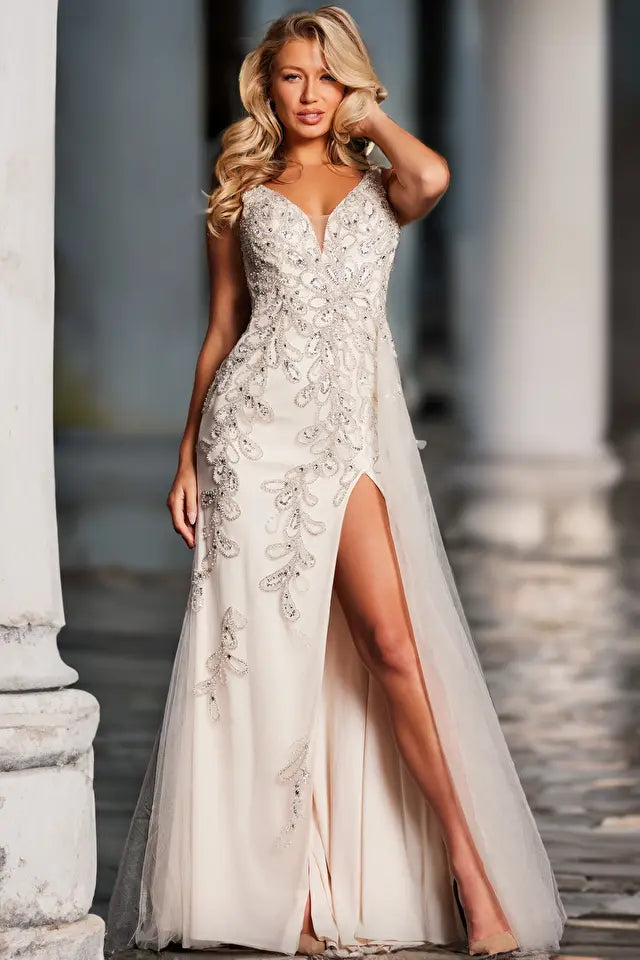 Elevate your formal look with the Jovani 39105 prom dress, a captivating and versatile gown suitable for proms, weddings, and other formal events. Crafted from luxurious beaded mesh, this fitted dress is designed to highlight your figure. It features a daring high slit and a graceful long side tail, adding a touch of drama and elegance.