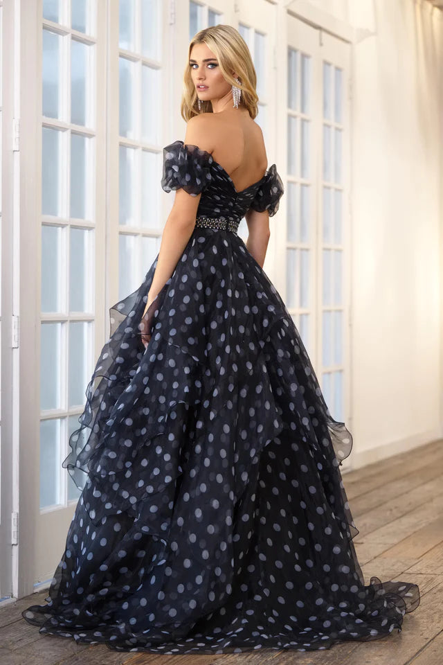 This Ava Presley 39318 prom dress is the perfect choice for any formal occasion. Its off the shoulder design and open back add a touch of elegance, while the layered organza ruffles create a unique and flattering silhouette. Turn heads and feel confident in this stunning pageant gown.