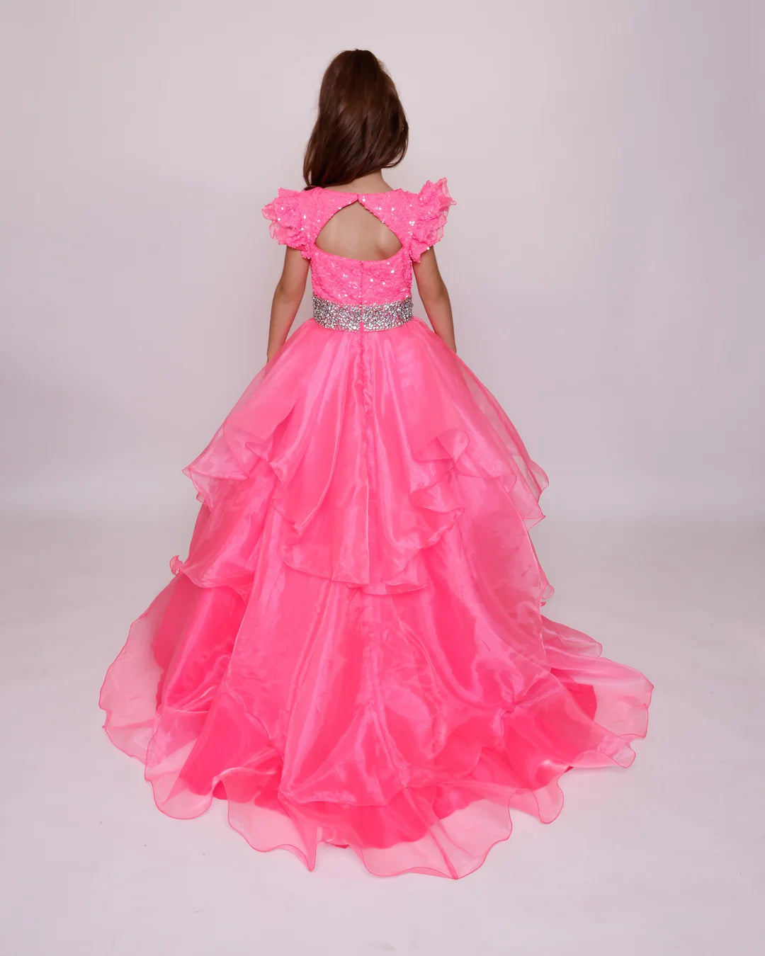 Expertly crafted and elegant, the Ava Presley 39892 girls pageant dress features a stunning blend of sequins and a keyhole ball gown train. The cap sleeves and layered design add a touch of sophistication, while the high-quality construction ensures a flawless fit for your little princess.