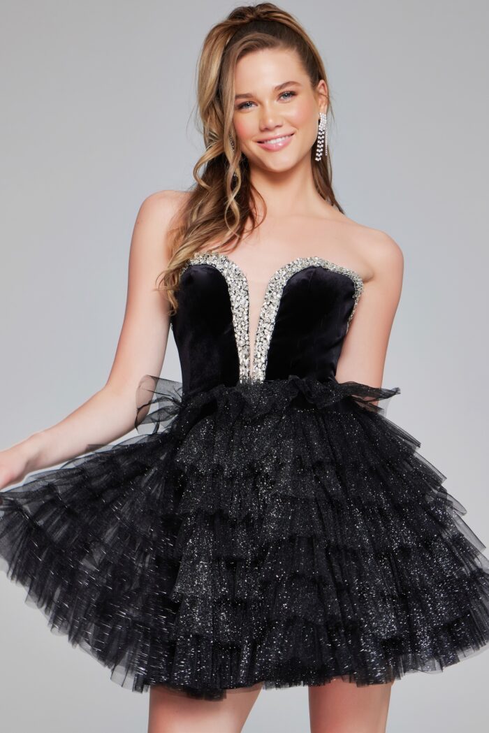 Expertly designed by Jovani, the 40352 Velvet Short Cocktail Dress offers a stunning combination of velvet bodice and layered tulle skirt. The strapless sweetheart neckline is adorned with sparkling crystals, making this gown perfect for homecoming or pageant events.