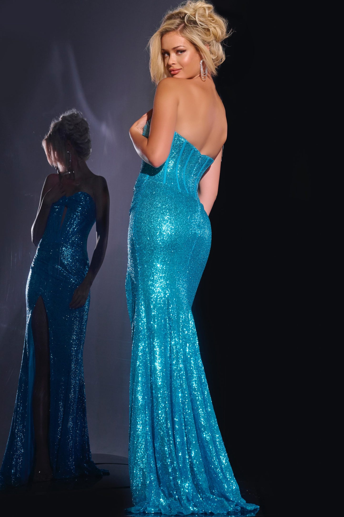 Shine bright in the Jovani 42514 Long Sequin Keyhole Corset Prom Dress. Featuring a keyhole corset top, sequin detailing, and a flattering slit, this formal gown is perfect for any special occasion. Make a statement with the strapless ruched design and stand out from the crowd.

Sizes: 00-24

Colors: Black, Orange, Turquoise, White/AB