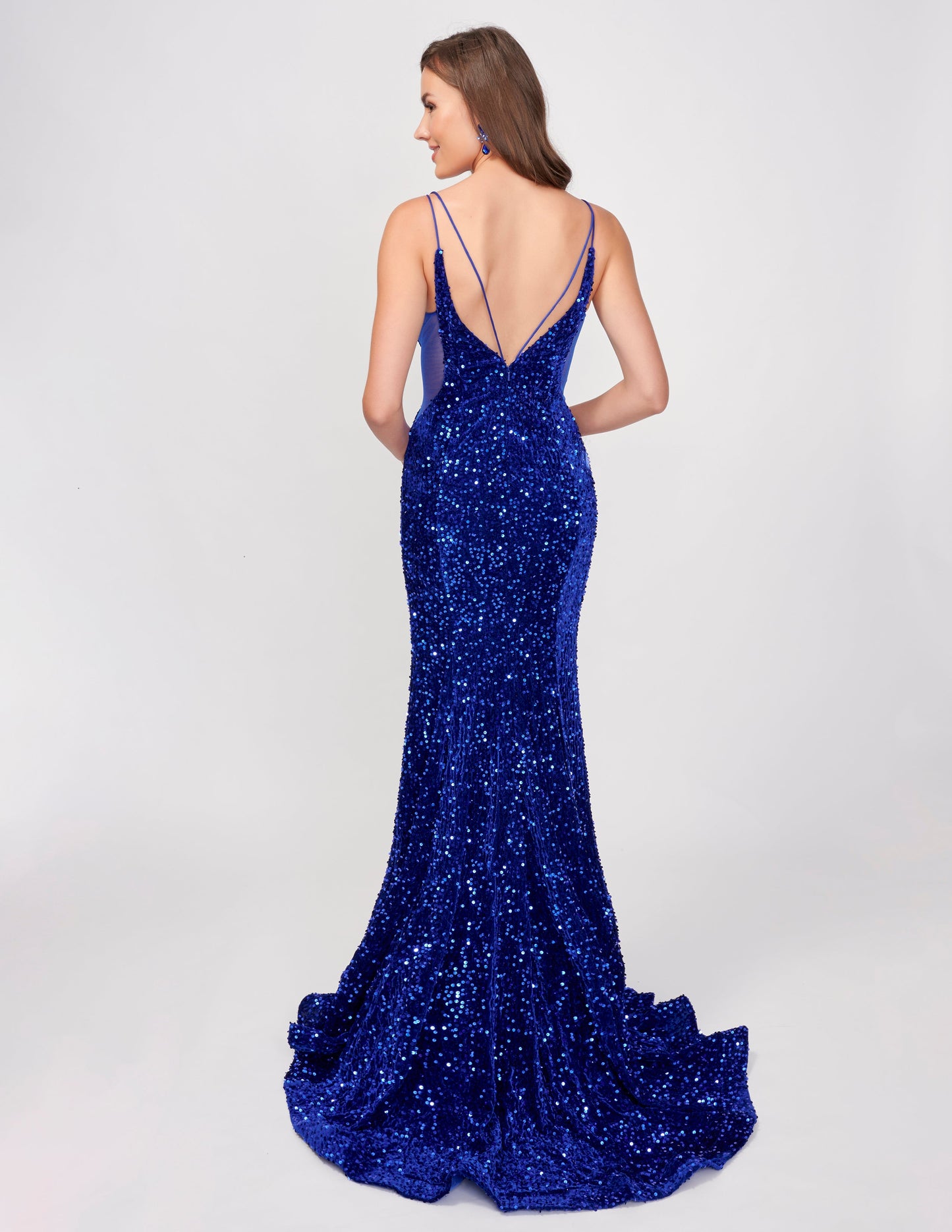 Elevate your style with the Nina Canacci 4420 Velvet Sequin Mermaid Prom Dress. Featuring a striking sheer v-neckline and stunning velvet sequin design, this formal evening gown is sure to make a statement. With its flattering mermaid silhouette, it's the perfect choice for a prom or special occasion.