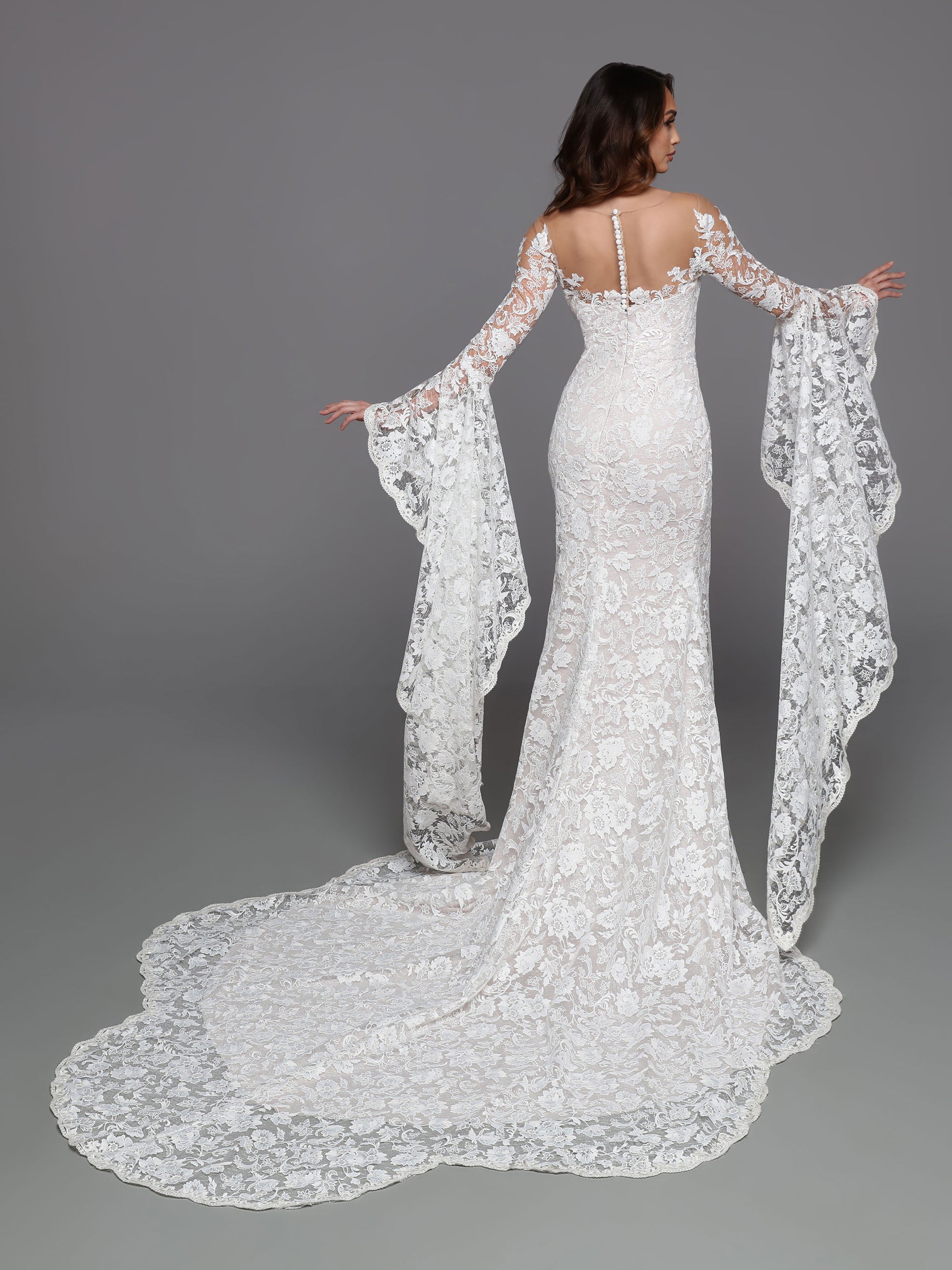 The Davinci Bridal 50735 Long Bell Sleeve Lace Wedding Dress Sheer Mermaid Bridal Gown is a timeless, sophisticated choice for your special day. Embellished with intricate lace details and featuring an illusion neckline for security, this floor-length gown will create a beautiful silhouette with its vintage-inspired bell sleeves and shaped train. 