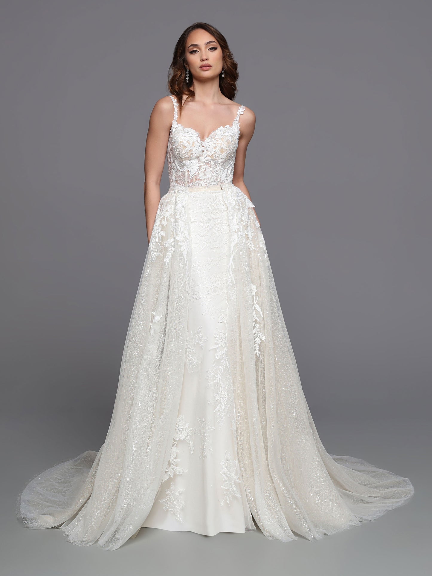 Featuring sheer beaded lace and a wide ribbon corset, Davinci Bridal 50738 is the perfect fit & flare sheath wedding dress. Create your dreamy walk down the aisle with the detachable skirt and extended tulle train. Accentuate your figure and showcase your sense of style with this elegant option. 