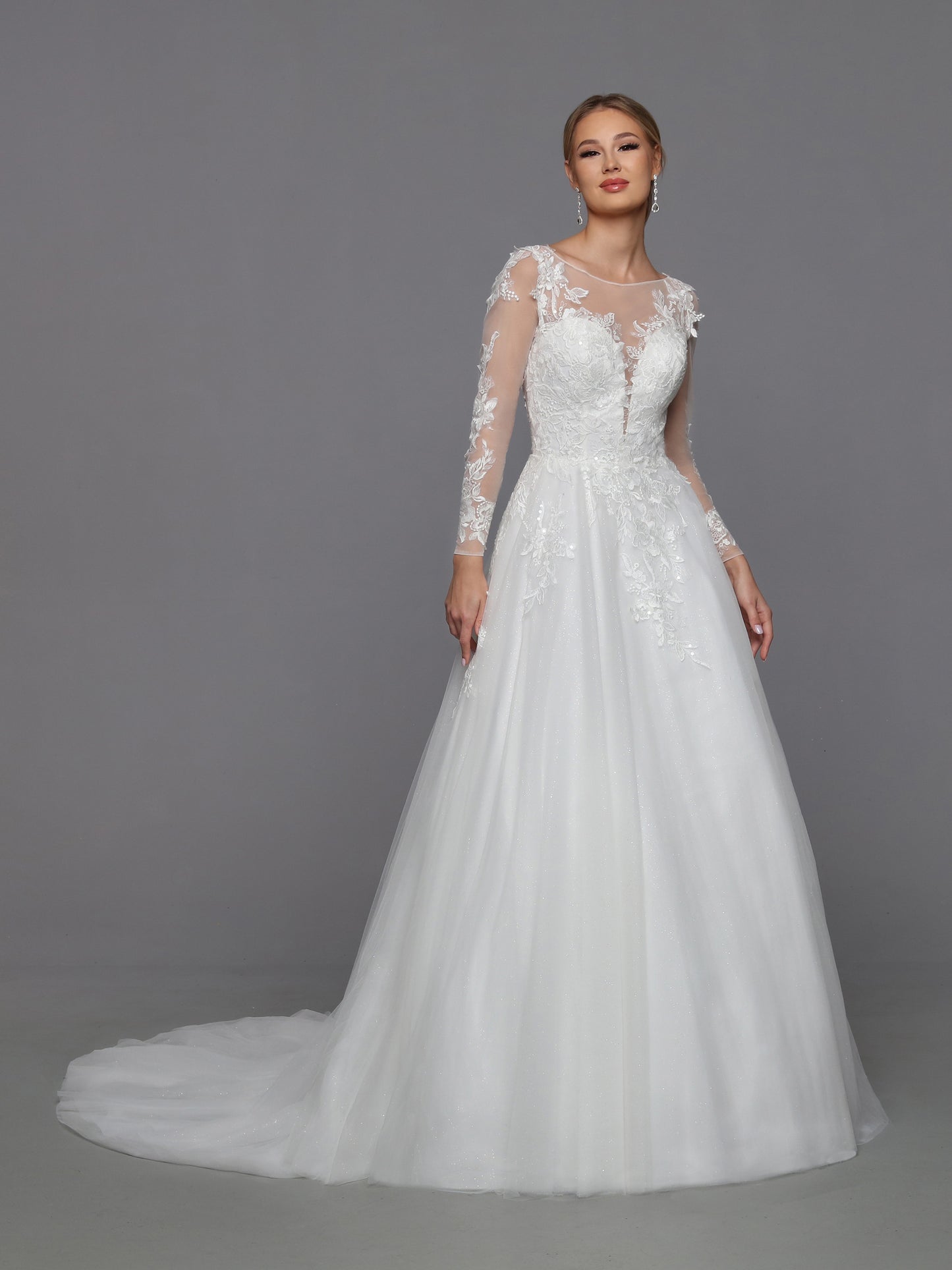 DaVinci Bridal 50769 A-Line Ballgown Illusion High Neck Long Sleeve Floral Lace Train Wedding Gown. Convertible dresses are always on-trend, like this lush ball gown with sheer full-length sleeves highlighted with rich lace applique. The alluring low scoop back is balanced by the modest bateau neckline.