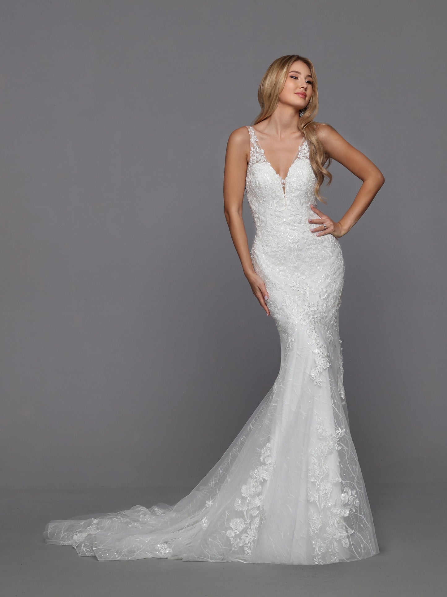 DaVinci Bridal 50770 Mermaid Fit And Flare V-Neck Lace Tulle Open Back Train Wedding Gown. This tempting slip dress has all the details you love. A sheer bodice covered with beaded lace applique, side cutouts, and a deep scoop back. A sheer textured lace skirt embellished with matching applique. And the finishing touch of a row of covered buttons running from the back waistline to the chapel train.