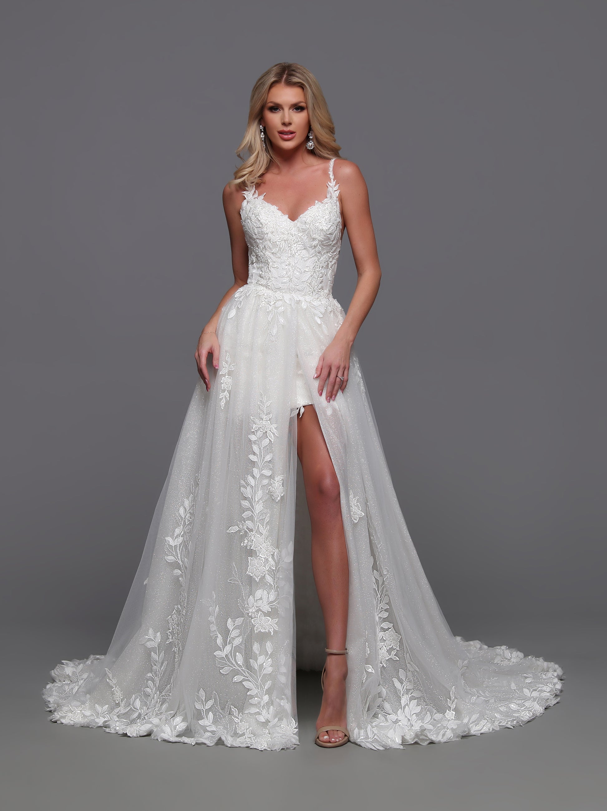 Exude elegance and sophistication with our Davinci Bridal 50872 Convertible Wedding Dress. This stunning gown features a detachable a-line overskirt, delicate lace details, and shimmering sequins. Transform your look from ceremony to reception with ease. Perfect for the modern bride seeking versatility and luxury.