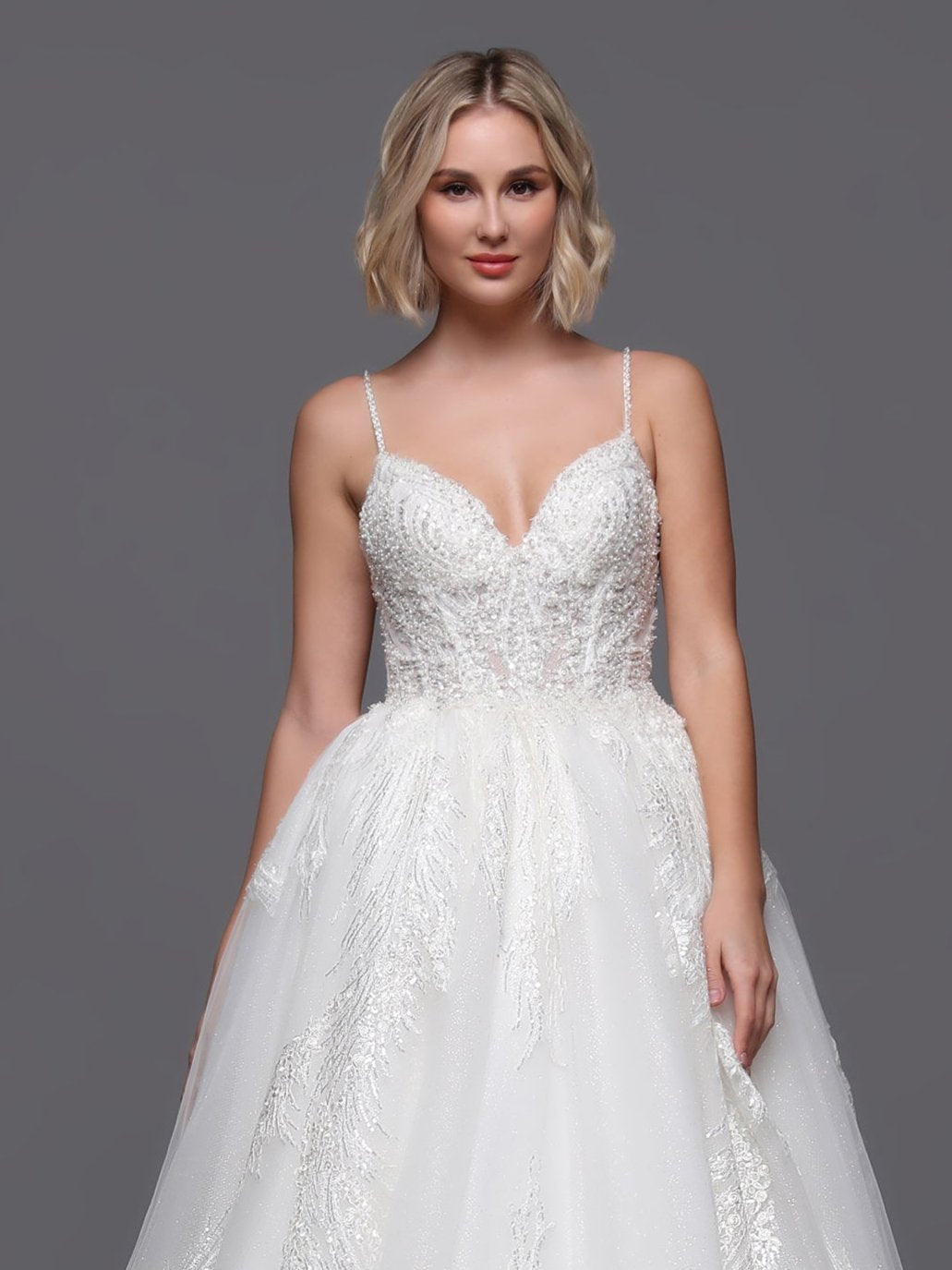 Elevate your bridal style with our Davinci Bridal 50876 beaded sequin wedding dress. The intricate beading and shimmering train add a touch of elegance fit for a princess. Walk down the aisle in this stunning gown and make a statement on your special day.