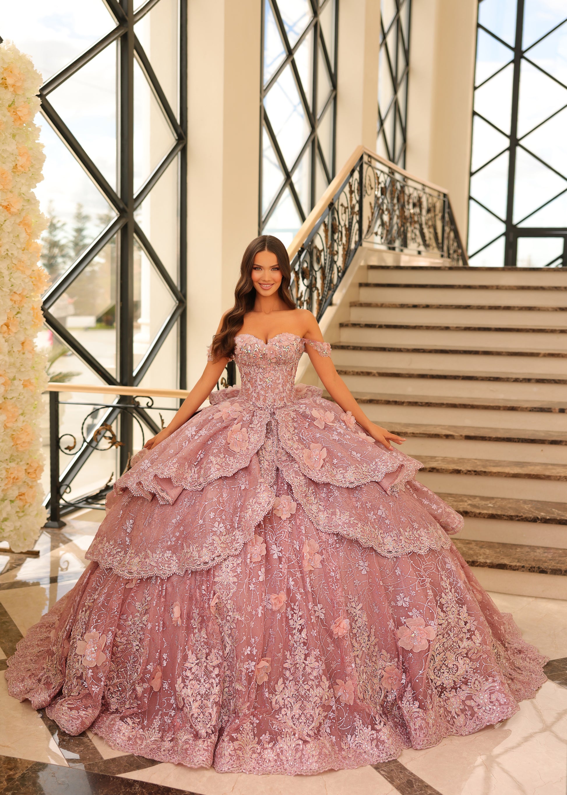 Get ready to shine in this enchanting quinceañera gown! The sweetheart neckline radiates elegance, while off-the-shoulder sleeves bring a playful charm. With its fitted bodice and full-length ball gown silhouette, you'll captivate everyone's gaze. But what truly sets this gown apart are its special touches. Delicate lace 