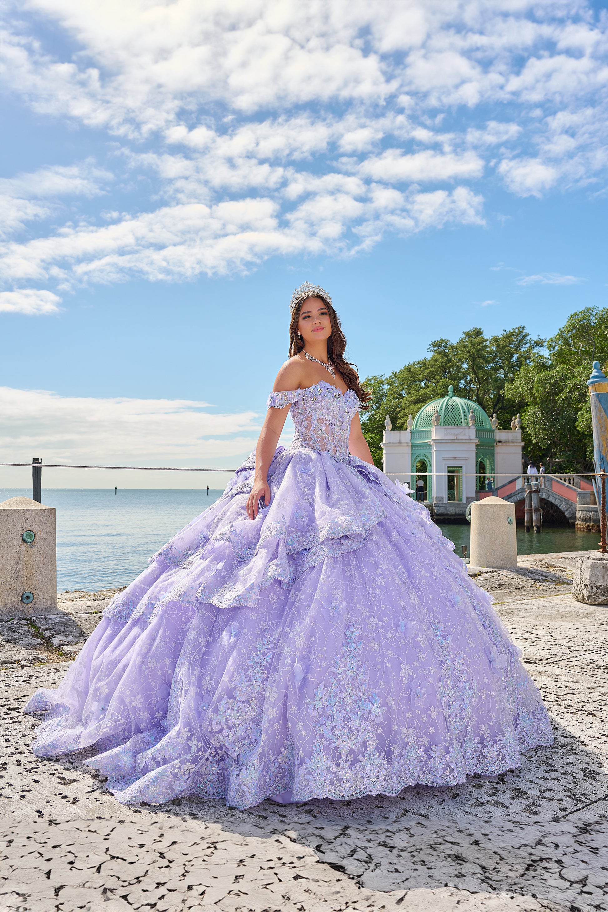 Get ready to shine in this enchanting quinceañera gown! The sweetheart neckline radiates elegance, while off-the-shoulder sleeves bring a playful charm. With its fitted bodice and full-length ball gown silhouette, you'll captivate everyone's gaze. But what truly sets this gown apart are its special touches. Delicate lace 