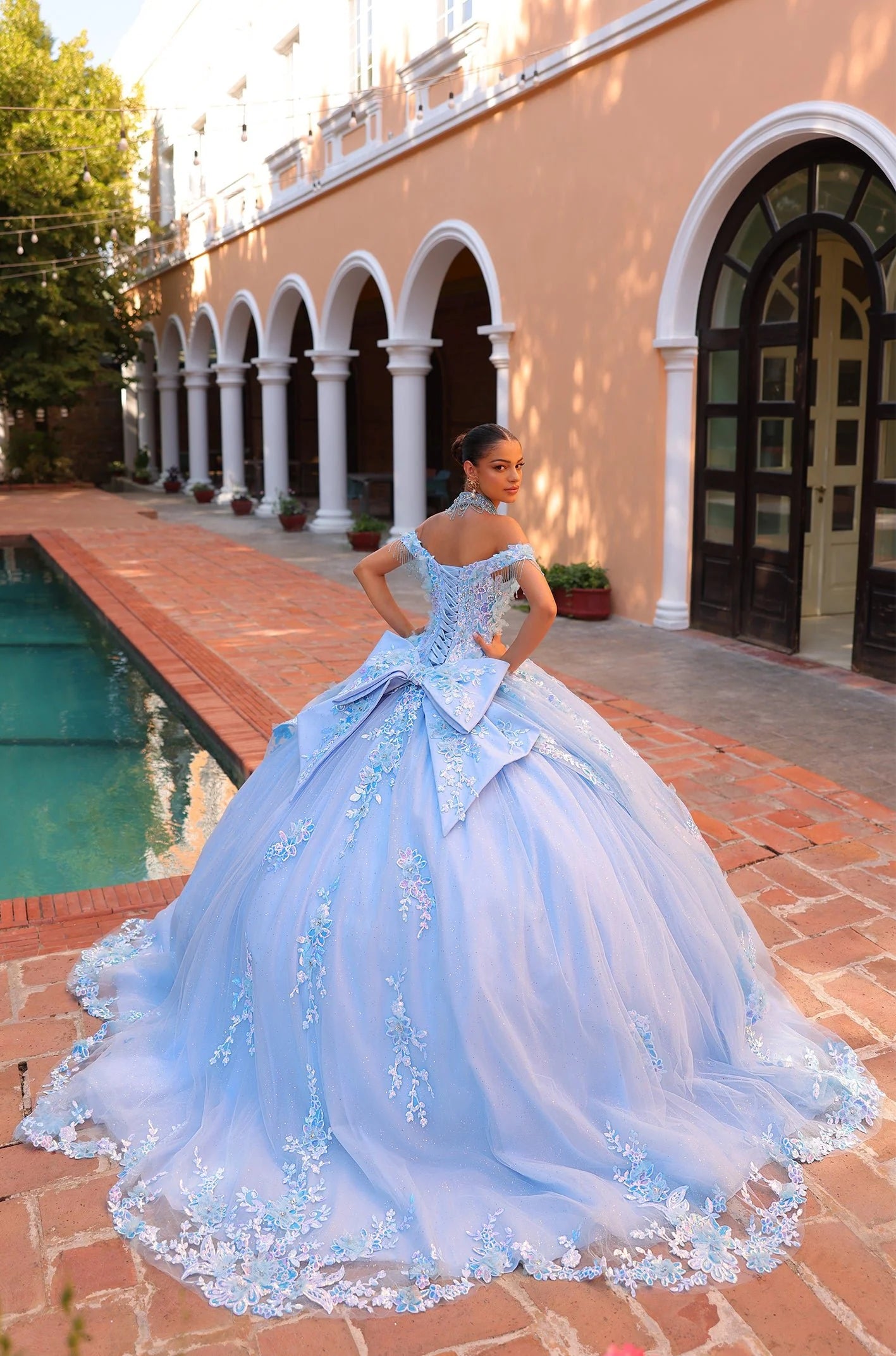 Effortlessly radiant and elegant, the Amarra 54305 quinceanera dress showcases a shimmering ballgown design with an off the shoulder fringe cape and intricately beaded sequin details. The layered lace skirt adds a touch of glamour to this stunning dress, ensuring you will stand out at any special occasion. Cinderella