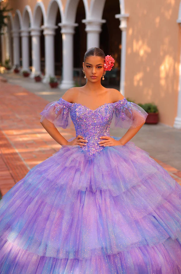 Elevate your Quinceañera look with the stunning Amarra 54312 dress. Featuring a layered tulle ball gown with a shimmering sequin bodice and an off-the-shoulder neckline, this dress will make you shine on your special day. The ombre corset adds a touch of glamour, making you the belle of the ball.&nbsp;