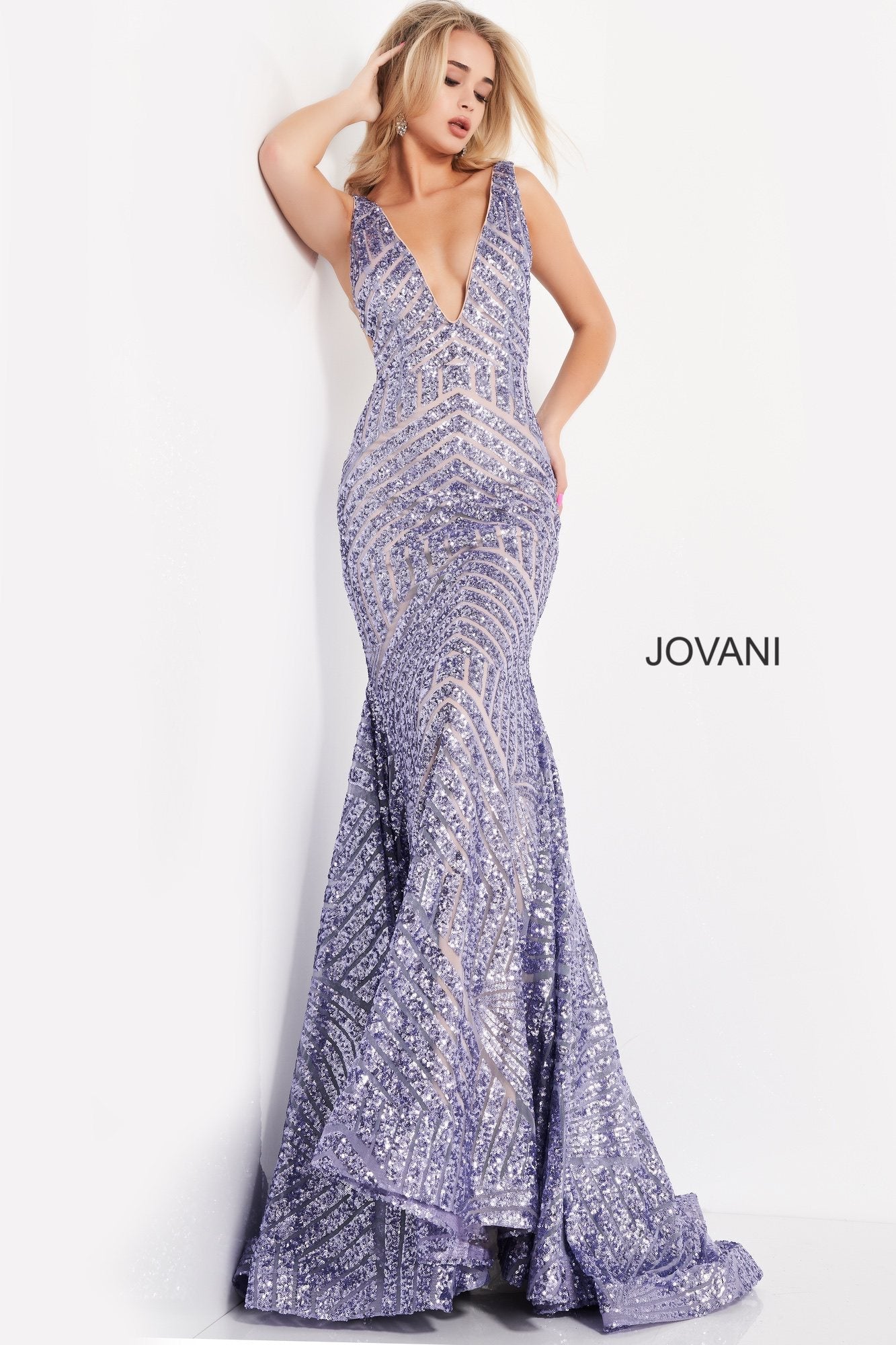 Long Jovani 59762 Prom Dress, Featuring a plunging neckline & A Fully sequined Fitted Mermaid Bodice. This Open V Back Pageant Gown & prom dress is perfect for the stage is has a lush trumpet sequin embellished skirt and sweeping train. 