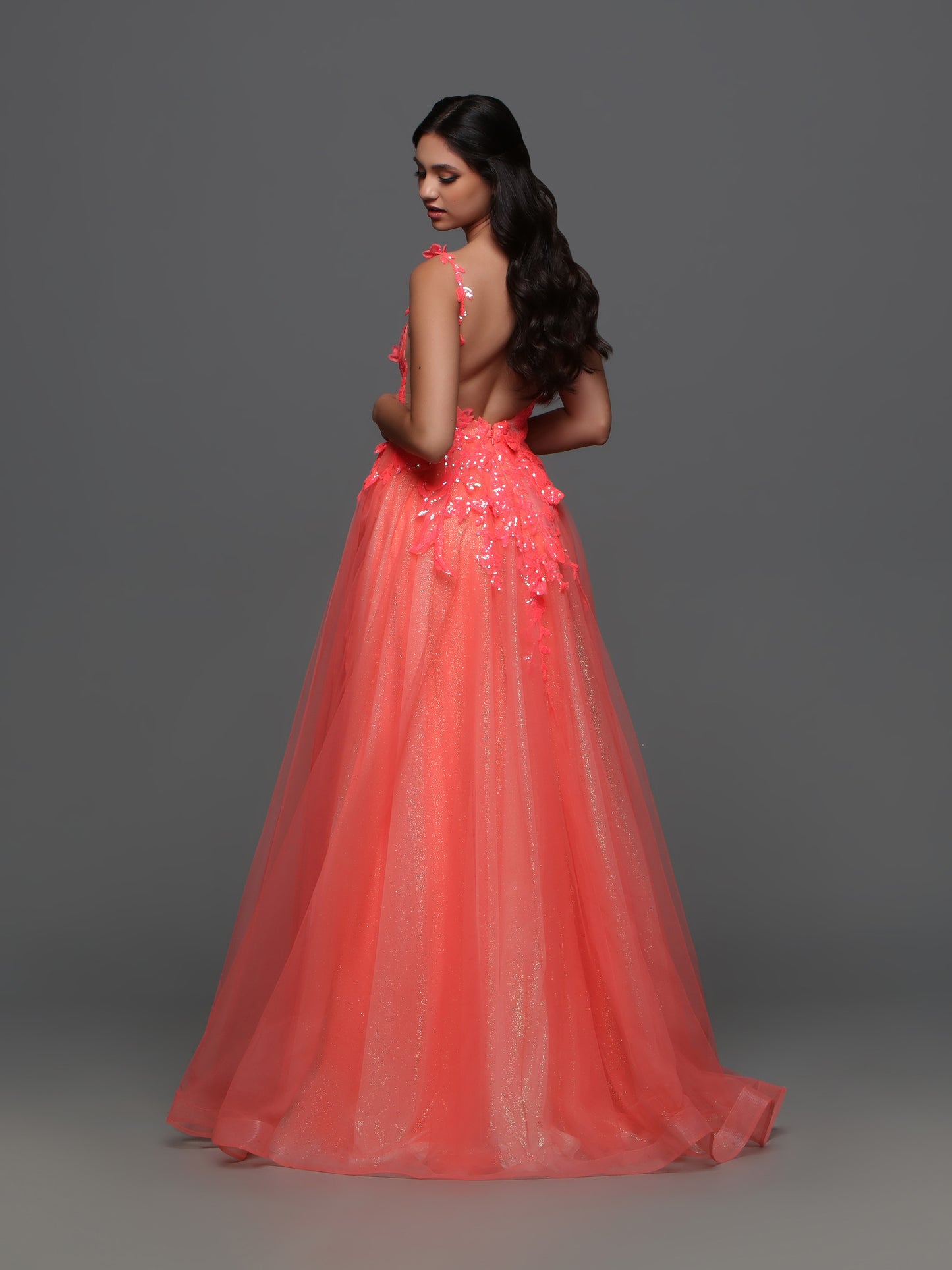 Elevate your formal look with the Candice Wang 72388 Long Shimmer Sequin Ballgown Prom Dress. The A-line silhouette and Glitter tulle details are complemented by the shimmering sequin lace, giving you an undeniable sparkle. Make a statement at your next event with this elegant and stylish dress.  Sizes: 0-20  Colors: Coral 