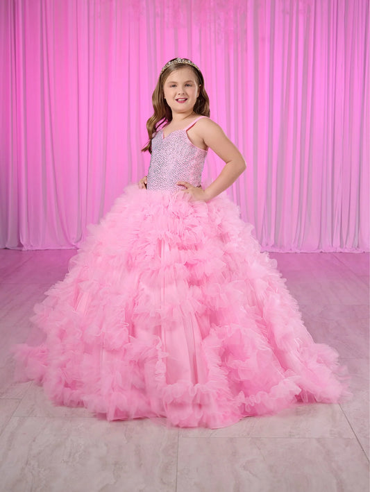 Rule the pageant stage with the Tiffany Princess 80023MQ Girls Ruffle Dress. This stunning ball gown features a crystal-embellished corset bodice and flowing ruffled skirt, perfect for making a grand entrance. The elegant design will have your little girl feeling like royalty, while the comfortable fit allows for graceful movement