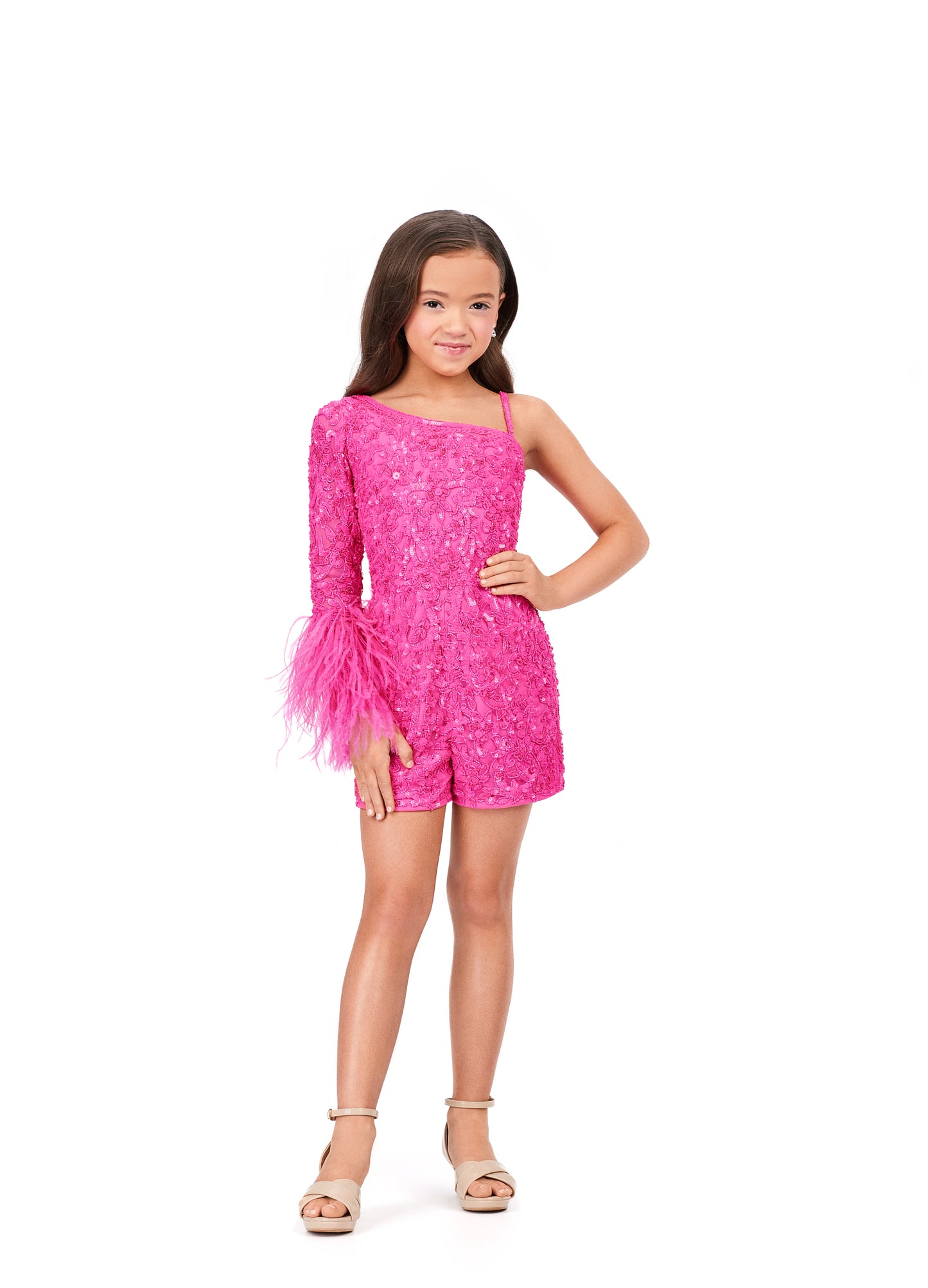 Ashley Lauren Kids 8192 One Shoulder Long Sleeve With Feather Detail Fully Beaded Romper. The cutest romper you ever did see! This one shoulder beaded romper features feather details on the wrist that gives the perfect amount of sass.