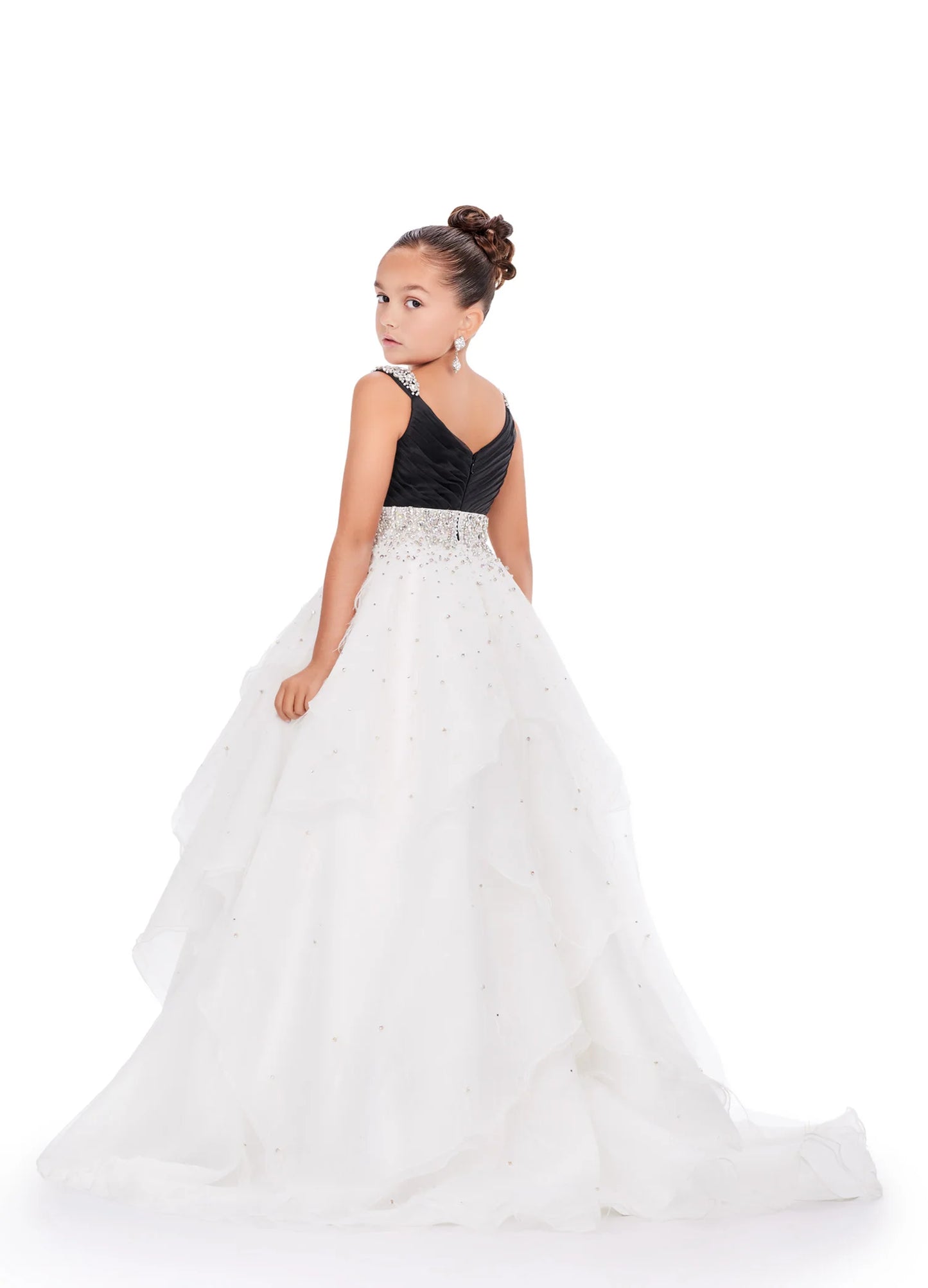 Elevate your little one's pageant look with the Ashley Lauren Kids 8219 Girls Layered Feather Pageant Dress. This stunning ballgown features a V-neck embellished with feathers, adding a touch of glamour to the overall design. With its layered skirt, this dress will make your child feel like a princess on stage. Be the star of the show in this fabulous organza ball gown