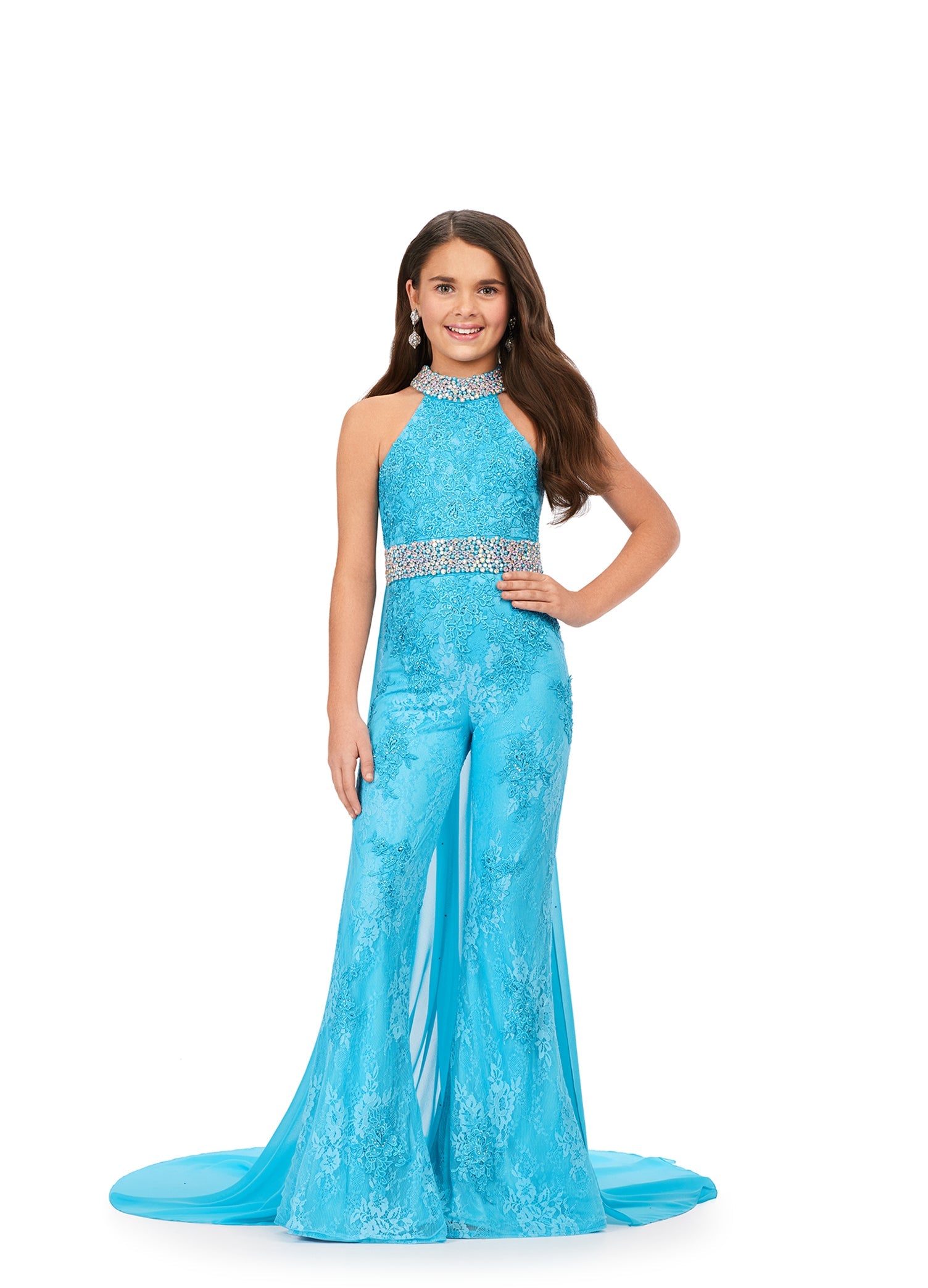 This Ashley Lauren Kids 8225 Girls Lace Crystal Jumpsuit Cape Bell Bottom Pageant Fun Fashion Wear is the perfect way to show off your sense of style. Its exquisite halter neckline and beaded accents make it a truly eye-catching piece. The chiffon cape and flare pant legs add a dramatic element and the jeweled belt and choker provide a touch of sparkle. Make a bold fashion statement with this beautiful jumpsuit!  Sizes: 4-16  Colors: Blue, Pink, Red