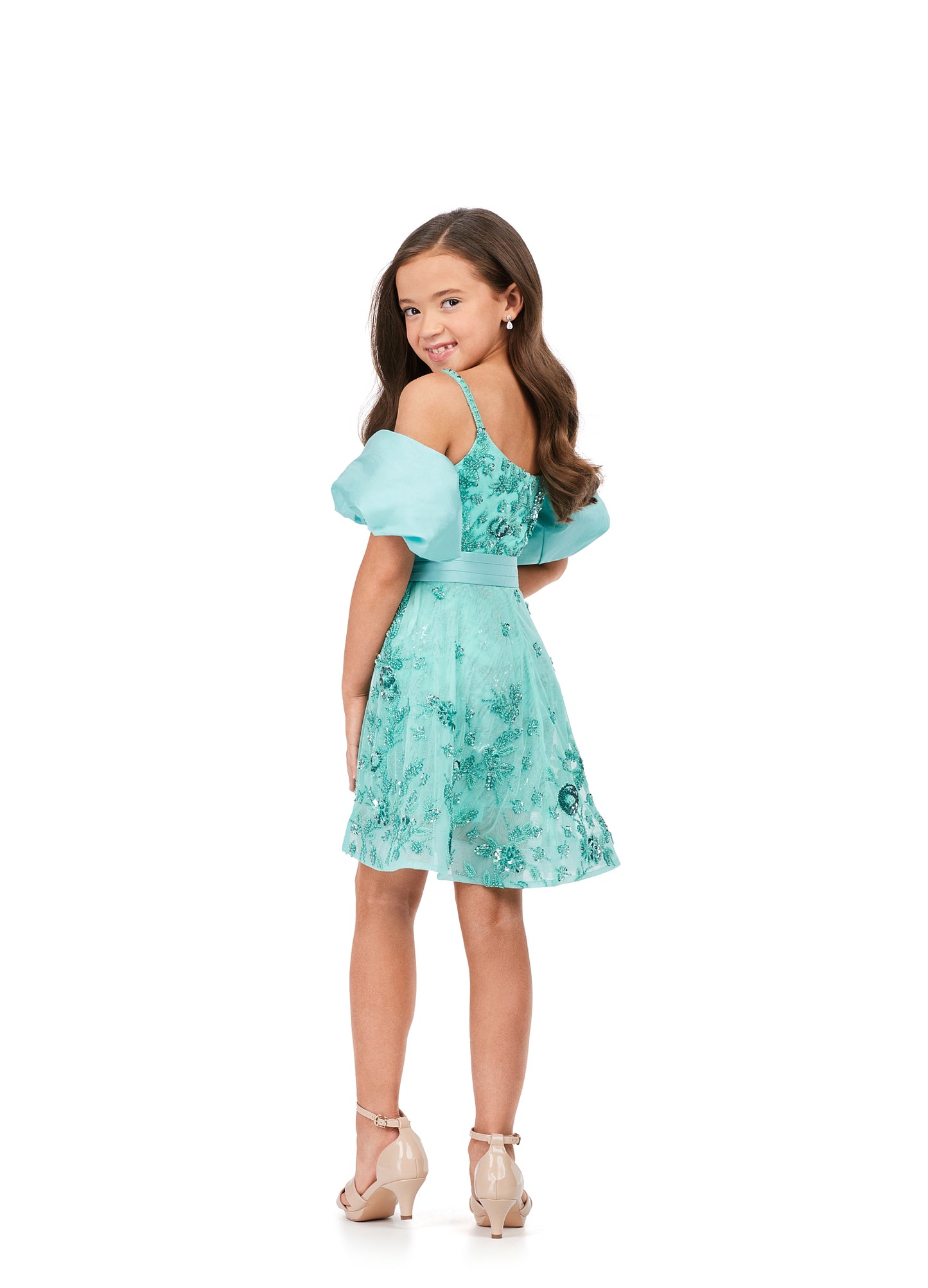 Ashley Lauren Kids 8233 Fully Beaded Spaghetti Straps With Detachable Puff Sleeves Detachable Overskirt Romper. Have the most fun in this beaded romper complete with detachable puff sleeves and an overskirt!