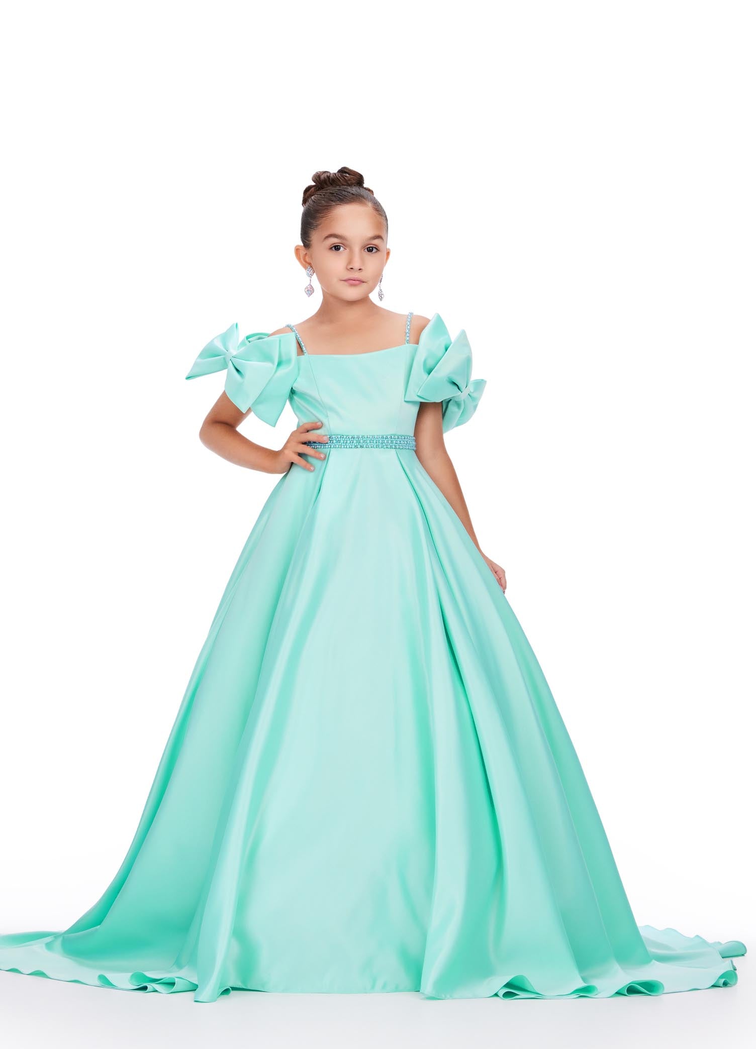 Ashley Lauren Kids 8237 Off the Shoulder Satin Ball Gown Pageant Dress Bows A Line Girls Feel like a princess in this satin ball gown. This gown features off the shoulder bows and pearl accents on the straps and belt.  COLORS: Aqua, Pink, White, Lilac Sizes: 2-16 Off Shoulder Beaded Accents Ball Gown Satin