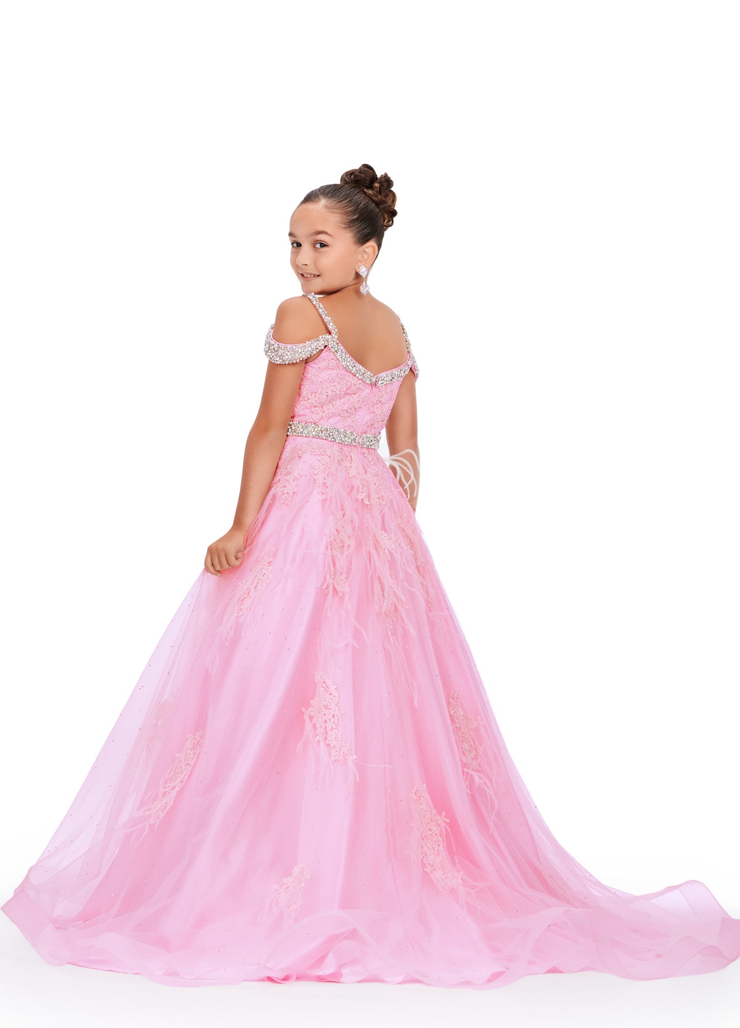 Experience the epitome of elegance and grace with the Ashley Lauren Kids 8242 Girls Lace Feather Pageant Dress. Featuring delicate lace and stunning feather accents, this off the shoulder ballgown is the perfect choice for any special occasion. Its impeccable design and craftsmanship will make your little girl feel like a true princess. This gorgeous kids gown is embellished with crystal beaded straps, neckline trim and belt. The dress is adorned with lace applique, press on stones and feather accents.