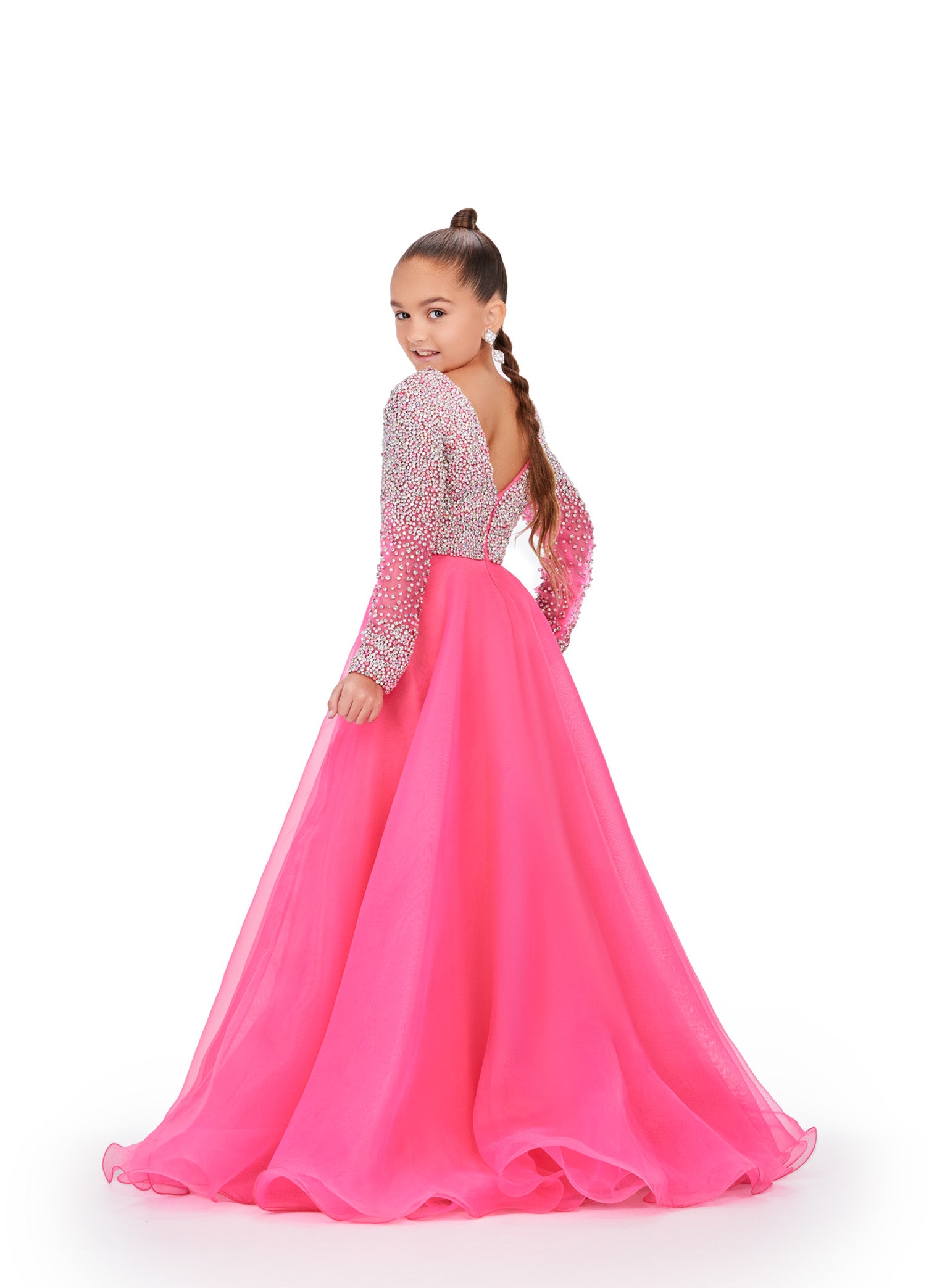 Elevate your little girl's style with this stunning Ashley Lauren Kids 8271 Pageant Dress. The intricate beaded details and long sleeve design add elegance and grace to the A-line silhouette, making her stand out on stage. Crafted with high-quality materials, this dress ensures unbeatable comfort and lasting wear. This elegant kids organza gown features a v-neckline with crystal and pearl details. The look is completed with long sleeves and an a-line skirt.