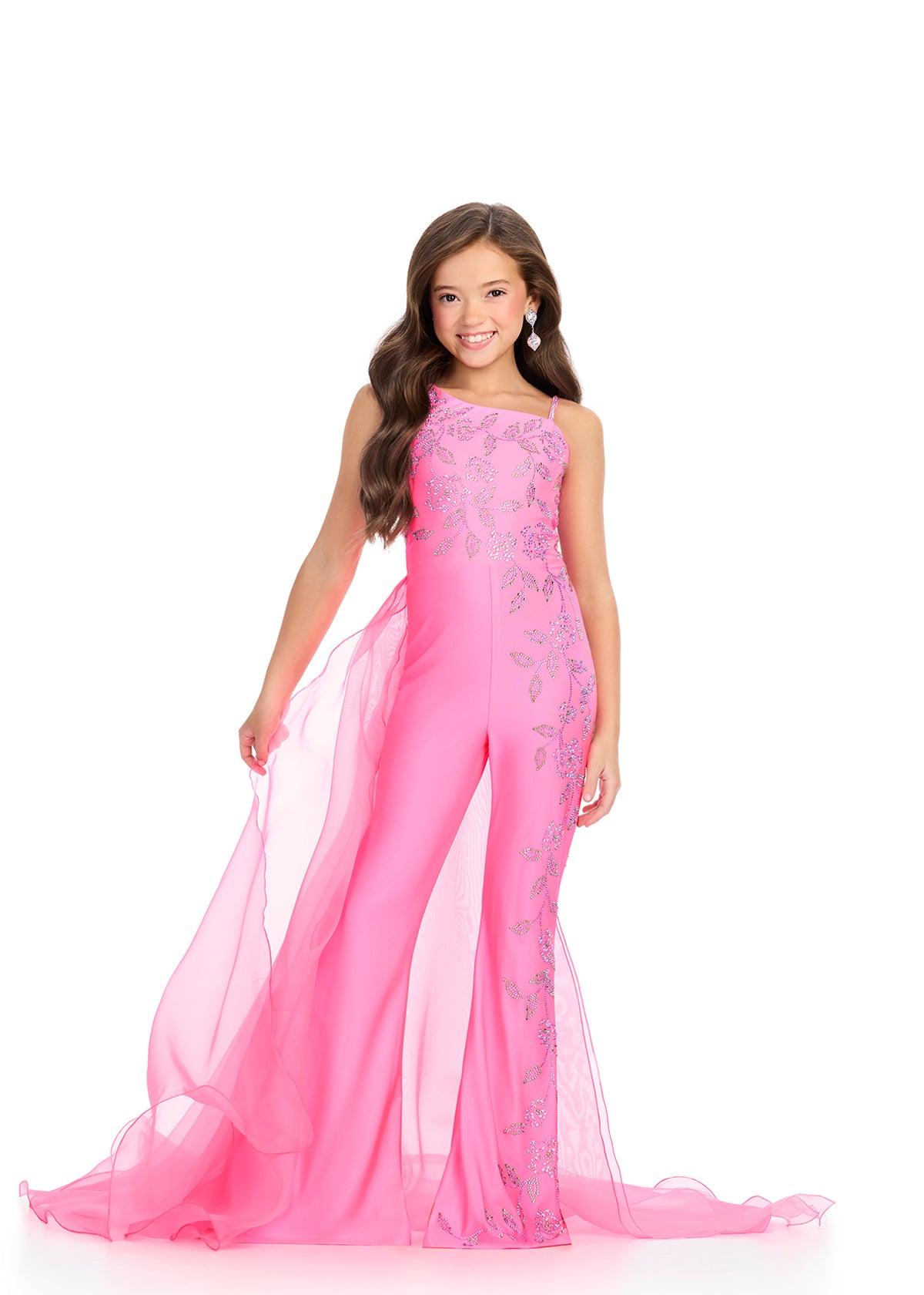 The Ashley Lauren 8274 Jersey Girls Jumpsuit is a stunning piece that features a unique embellished design with stones, combined with an elegant overskirt on one side. Perfect for making a statement at any event, this jumpsuit offers both style and comfort.