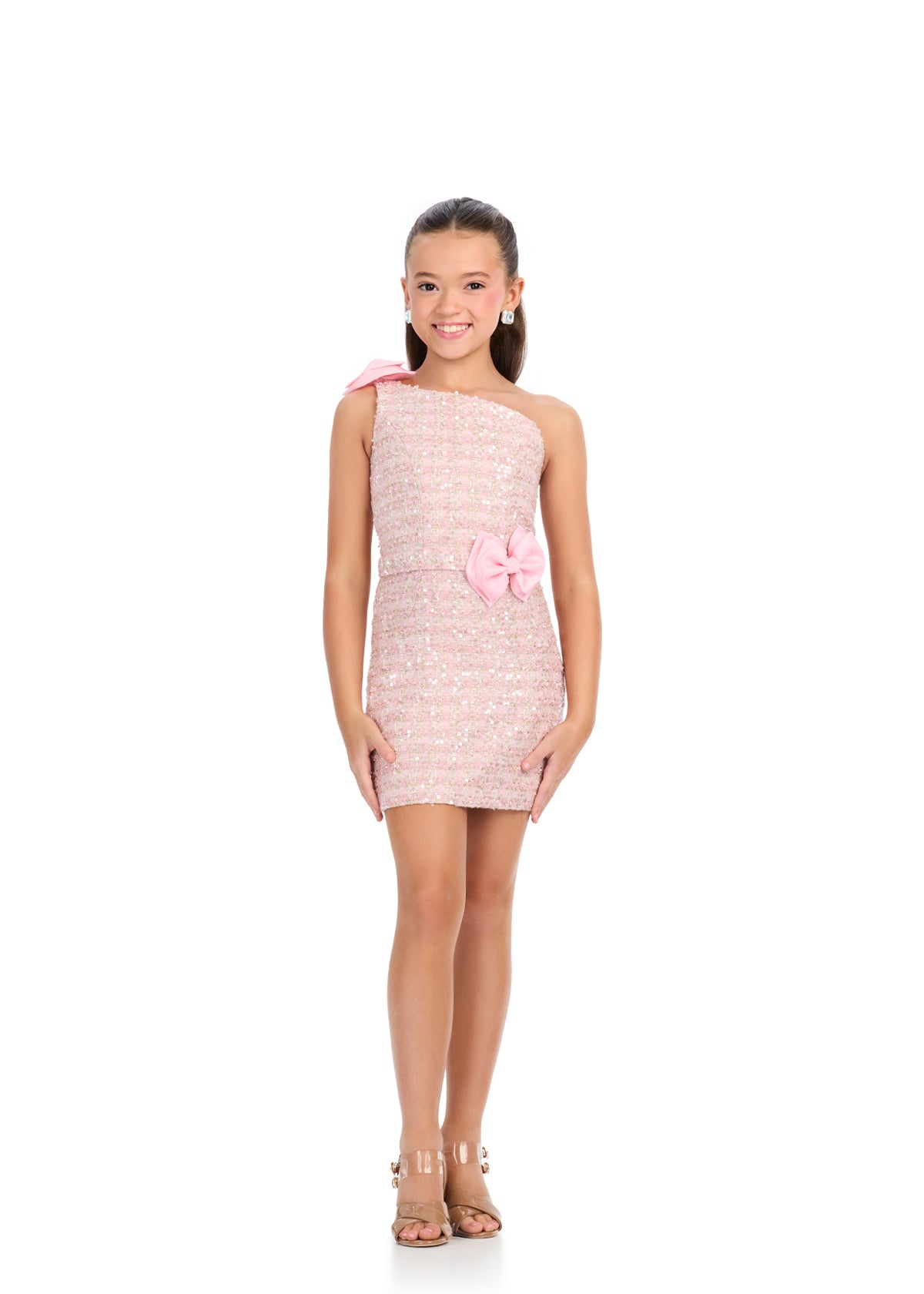 Elevate your little girl's formal wardrobe with the Ashley Lauren Kids 8303 Girls Tweed Cocktail Dress. The one-shoulder design and bow detail add a touch of sophistication, while the tweed fabric exudes elegance. Perfect for interviews or special appearances.&nbsp;one shoulder, shimmering piece is perfect for pageants, interviews, and formal events. Its unique design and bow detail make it a standout option. Expertly crafted with quality materials, you'll look and feel confident all night long.