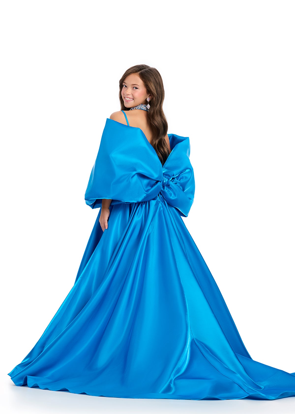 Introducing the Ashley Lauren Kids 8321 Oversize Bow Overskirt Pageant Accessory off the Shoulder Cape - the perfect addition to any pageant ensemble. The oversized bow and off the shoulder design add a touch of elegance and modernity to any outfit. Feel confident and glamorous on stage with this versatile accessory.&nbsp; Transform any outfit into a statement piece with this enchanting bow overskirt. This overskirt adds the perfect amount of glamour to any ASHLEYlauren cocktail dress, jumpsuit or dress.

B