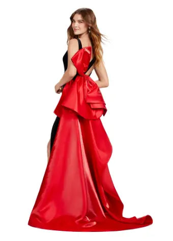 This Ashely Lauren 11527 Long Prom Dress is designed with a fitted V neckline, satin bow detailing, and a stunning open back. Its side skirt adds an elegant touch, perfect for formal events or pageants. Crafted with quality fabric, this gown exudes both style and comfort. Who doesn't love a bow moment? This v-neckline velvet gown features an inverted oversized satin bow and sweep train.