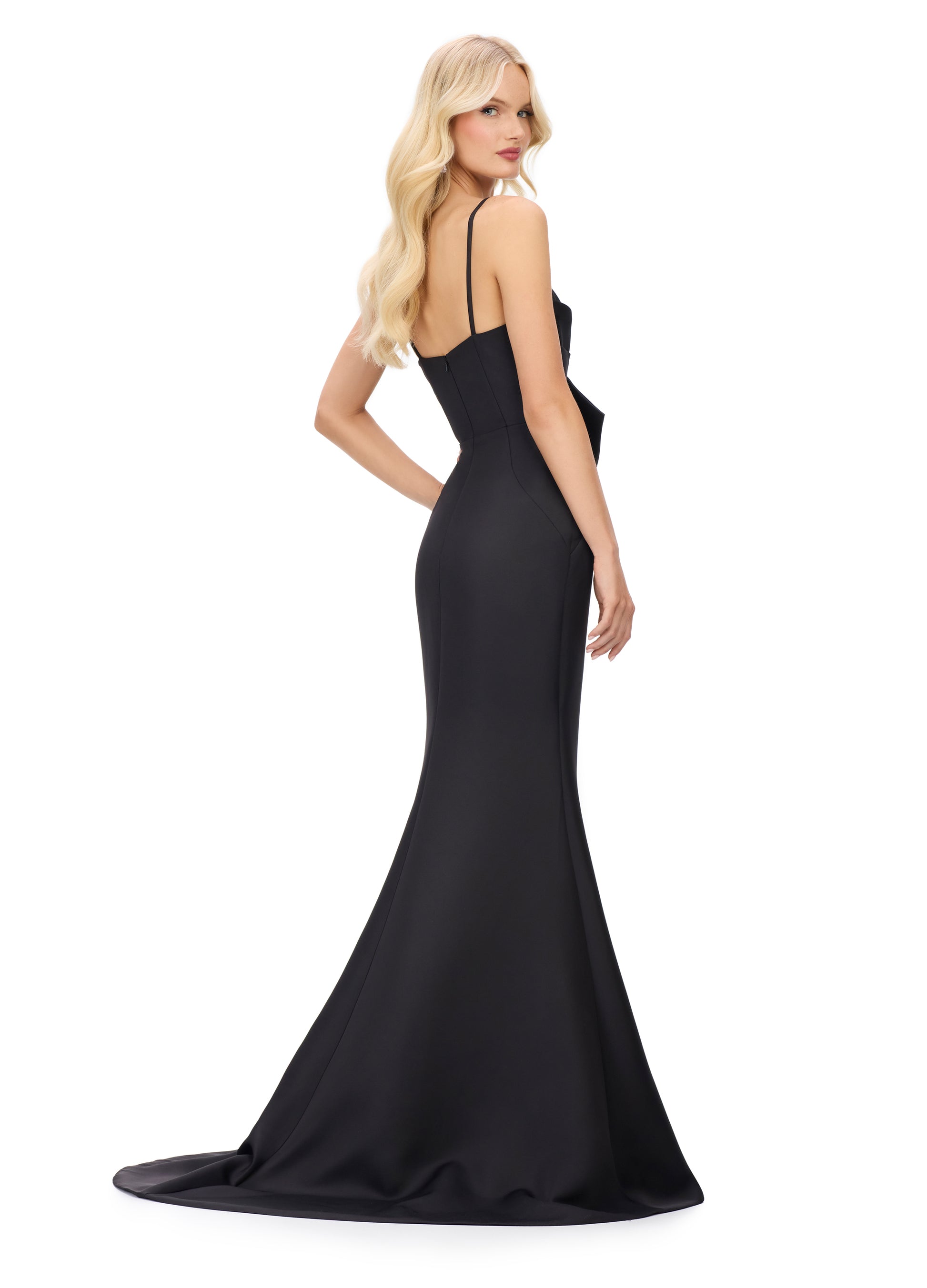 This Ashley Lauren 11702 evening gown boasts a striking large bow, spaghetti straps, and a flattering fit and flare silhouette. The bow bodice adds a touch of elegance, while the V neckline highlights your décolletage. Perfect for formal events and special occasions, this gown is sure to turn heads.