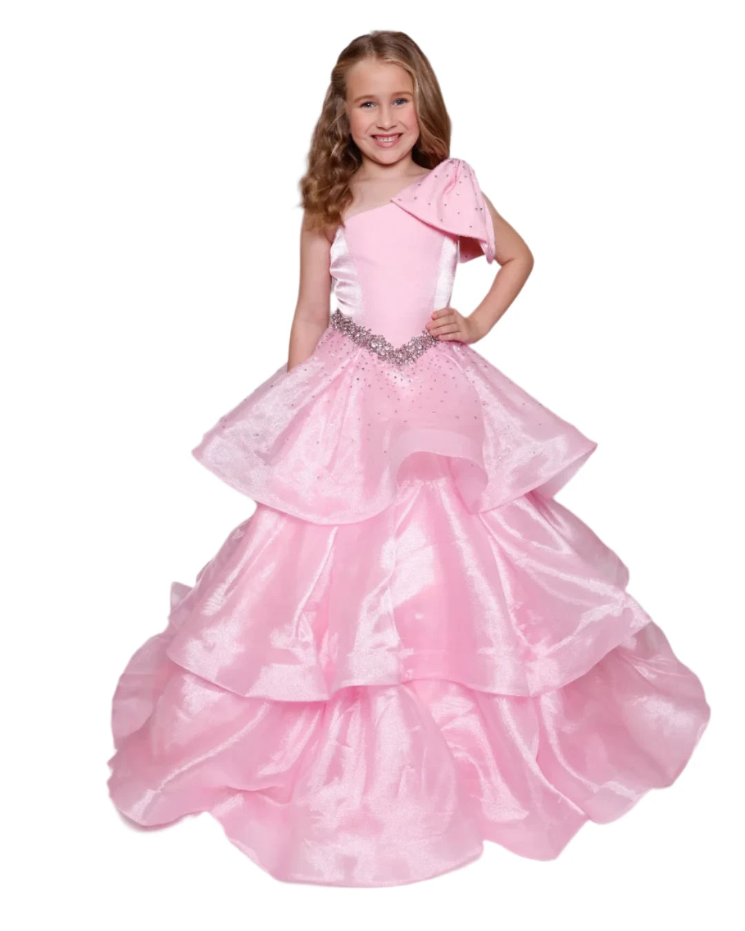 The Ava Presley Girls 39891 Long Pageant Ball Gown is a stunning formal dress designed with a one shoulder style and elegant ruffle details. The drop waist accentuates the silhouette and the layered skirt adds a touch of charm. Perfect for any special occasion, this gown exudes sophistication and grace. Turn heads in this Ava Presley 39891