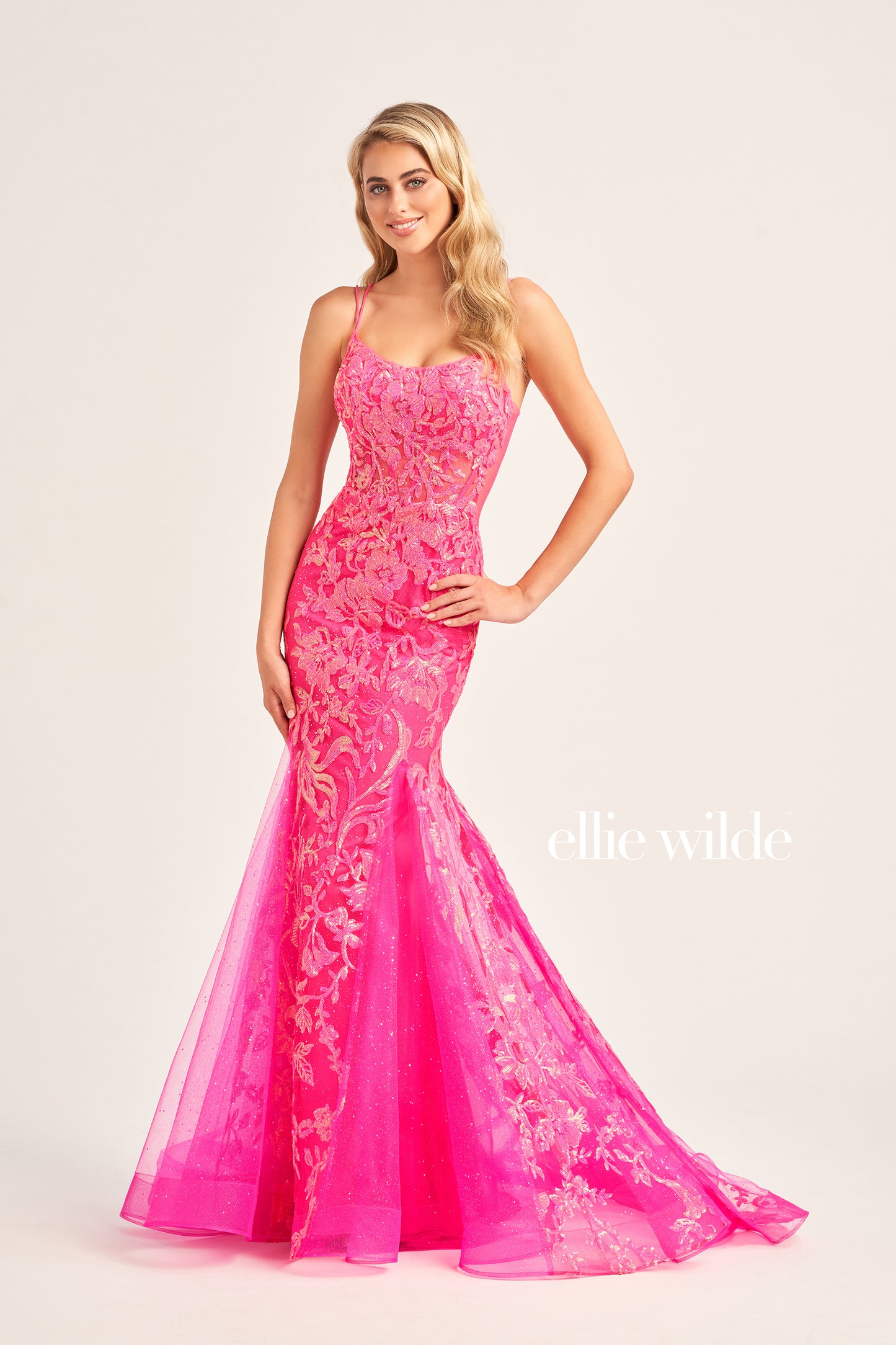 Show up in style with the Ellie Wilde EW35008 Long Sequin Shimmer Mermaid Prom Dress. Made with Glitter Sequin Tulle, this elegant gown has a Scoop Neckline, Sleeveless sleeves, Lace-Up back, and a Natural Waistline. Experience maximum comfort with the Side Waist Mesh Inset and Mermaid silhouette. Show off your curves in this figure-hugging dress!  COLOR: ORANGE, MAGENTA, ULTRA VIOLET, PERIWINKLE/OPAL SIZE: 00 - 20