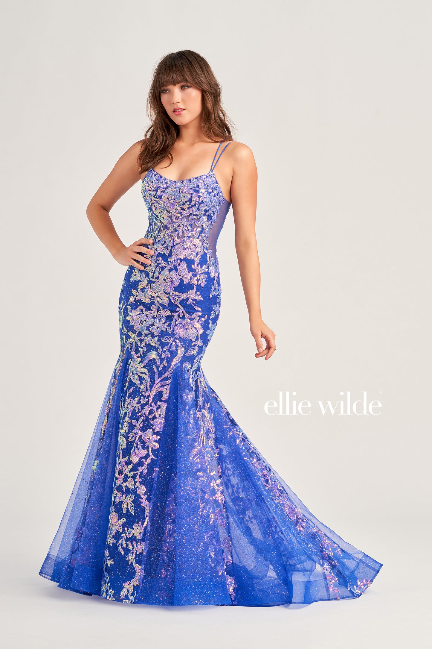 Show up in style with the Ellie Wilde EW35008 Long Sequin Shimmer Mermaid Prom Dress. Made with Glitter Sequin Tulle, this elegant gown has a Scoop Neckline, Sleeveless sleeves, Lace-Up back, and a Natural Waistline. Experience maximum comfort with the Side Waist Mesh Inset and Mermaid silhouette. Show off your curves in this figure-hugging dress!  COLOR: ORANGE, MAGENTA, ULTRA VIOLET, PERIWINKLE/OPAL SIZE: 00 - 20