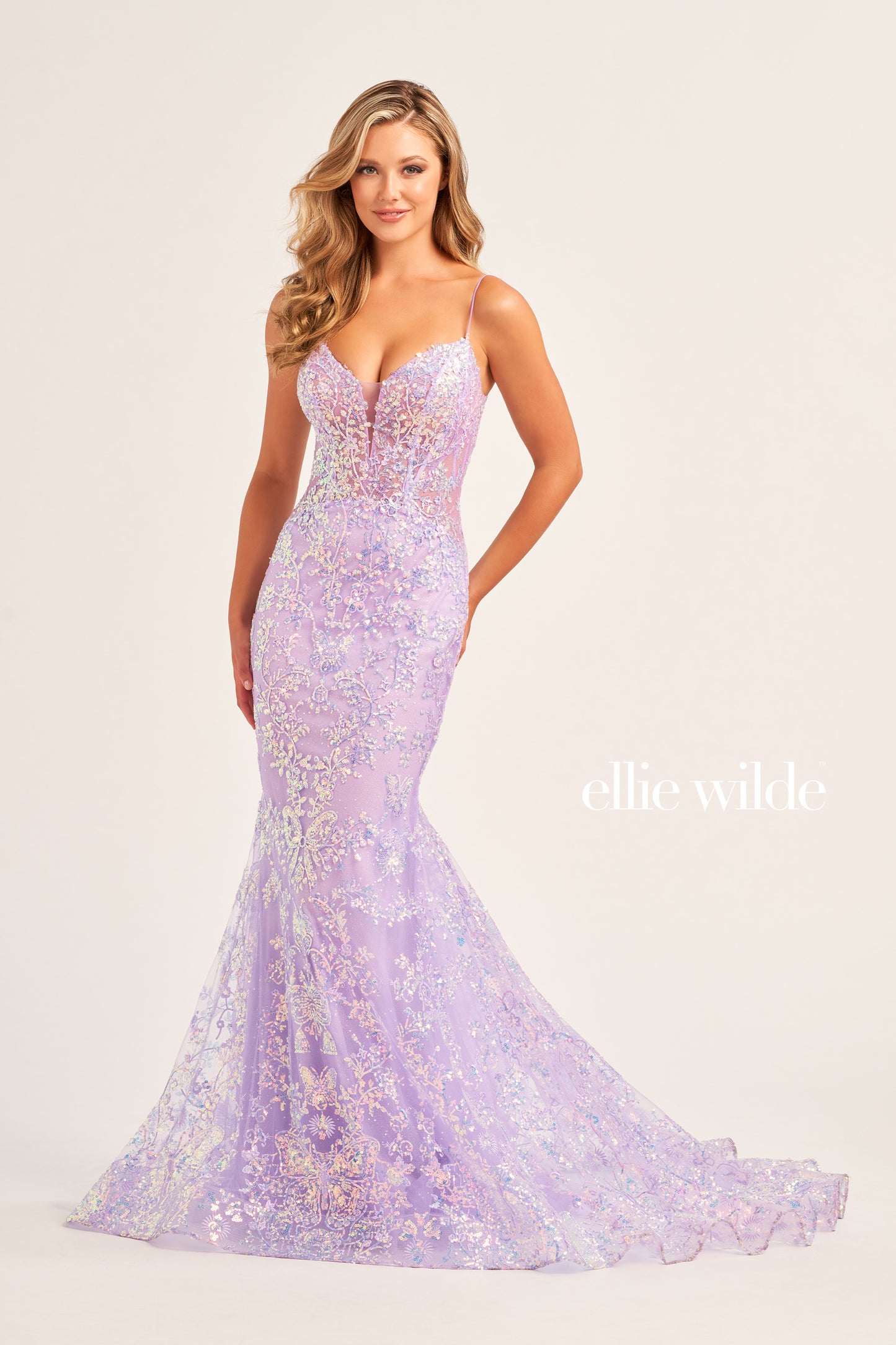 Make a stunning appearance at your next formal event in this Ellie Wilde EW35013 Long Fitted Sequin Mermaid Prom Dress. Crafted from an exquisite combination of Embroidered Tulle, Glitter Tulle, and Sequins, this beautiful dress includes a plunging Sweetheart neckline, a corset bodice with a lace-up back, and a trumpet silhouette for the perfect fit. The Natural waistline and Sleeveless design complete the look.  COLOR: BLACK, MIDNIGHT, LIGHT BLUE, LILAC, HOT PINK SIZE: 00 - 20