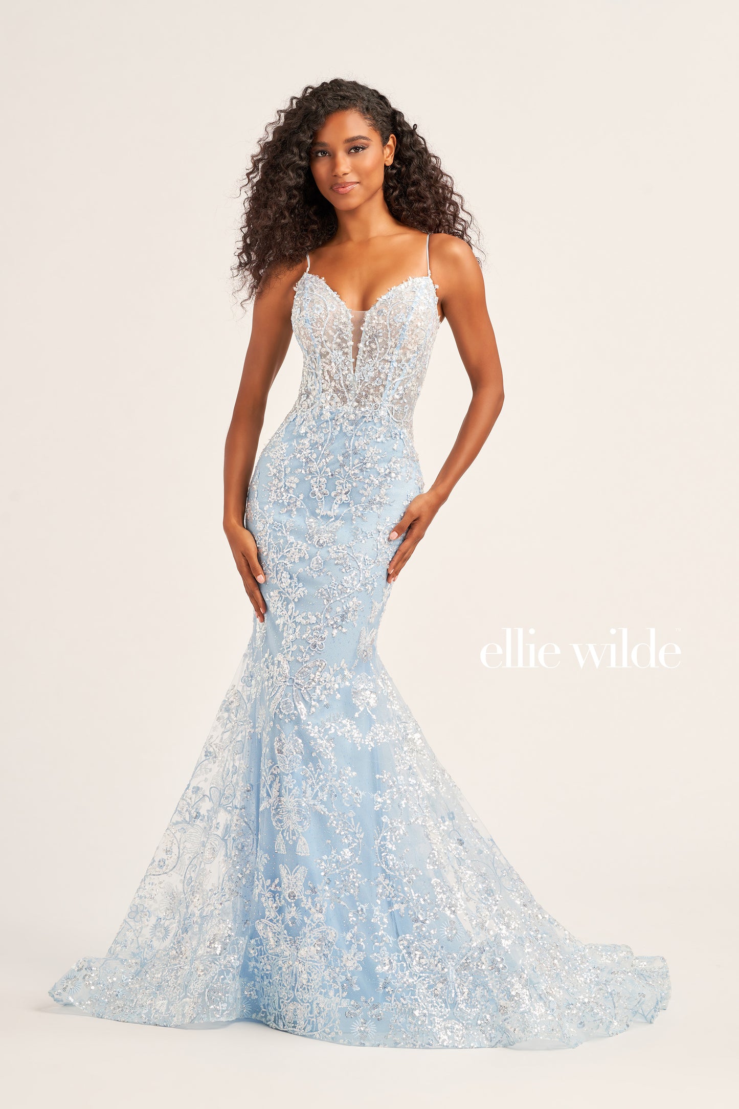 Make a stunning appearance at your next formal event in this Ellie Wilde EW35013 Long Fitted Sequin Mermaid Prom Dress. Crafted from an exquisite combination of Embroidered Tulle, Glitter Tulle, and Sequins, this beautiful dress includes a plunging Sweetheart neckline, a corset bodice with a lace-up back, and a trumpet silhouette for the perfect fit. The Natural waistline and Sleeveless design complete the look.  COLOR: BLACK, MIDNIGHT, LIGHT BLUE, LILAC, HOT PINK SIZE: 00 - 20