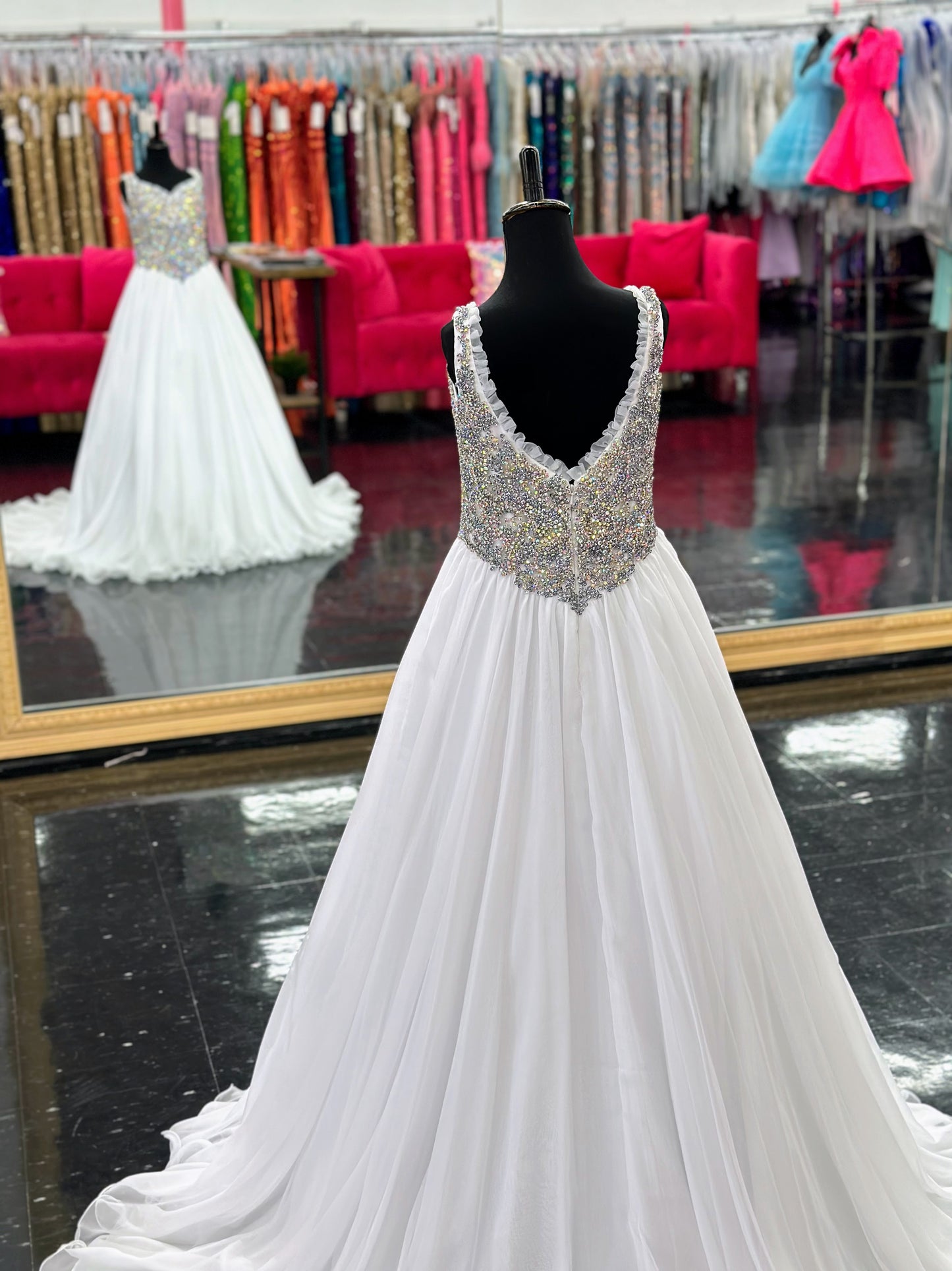 Experience the luxurious elegance of the Samantha Blake 1127 Pageant Dress. Made with soft, lightweight chiffon, this A-line ballgown will have your little girl feeling like a true princess. The crystal embellished bodice and ruffle trim neckline add a touch of sparkle and charm. Perfect for any pageant or special occasion.