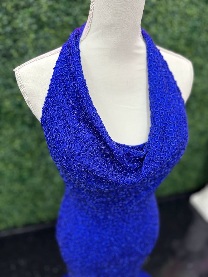 Johnathan Kayne 2728 is a size 4 cowl neck formal gown crafted with Custom Liquid Beading. The halter neck closure makes for a beautiful and stylish silhouette with a royal finish. Perfect for your next event!   ** One of a kind Custom  Size: 4  Color: Royal