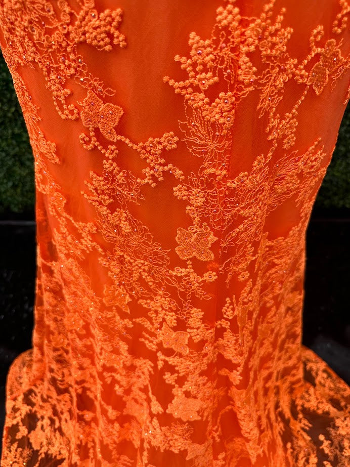 Look stunning in this Johnathan Kayne 31575 Size 4 Orange Lace V Neck Fitted Formal Prom Dress. Crafted from shimmering lace, this fitted design is sure to draw eyes. Show off your best features in this show-stopping dress.  Size: 4  Color: Orange