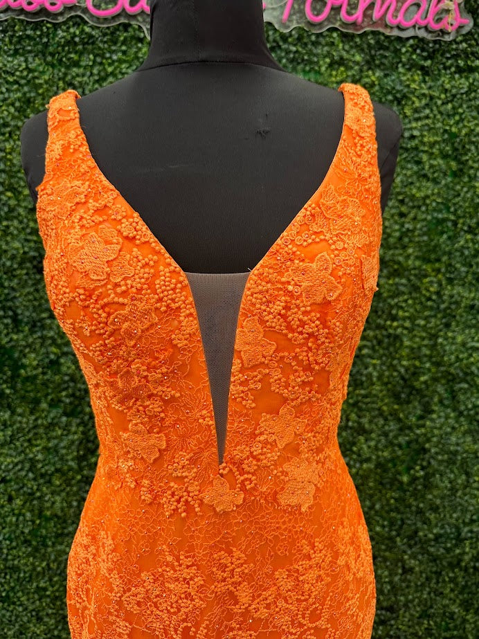 Look stunning in this Johnathan Kayne 31575 Size 4 Orange Lace V Neck Fitted Formal Prom Dress. Crafted from shimmering lace, this fitted design is sure to draw eyes. Show off your best features in this show-stopping dress.  Size: 4  Color: Orange