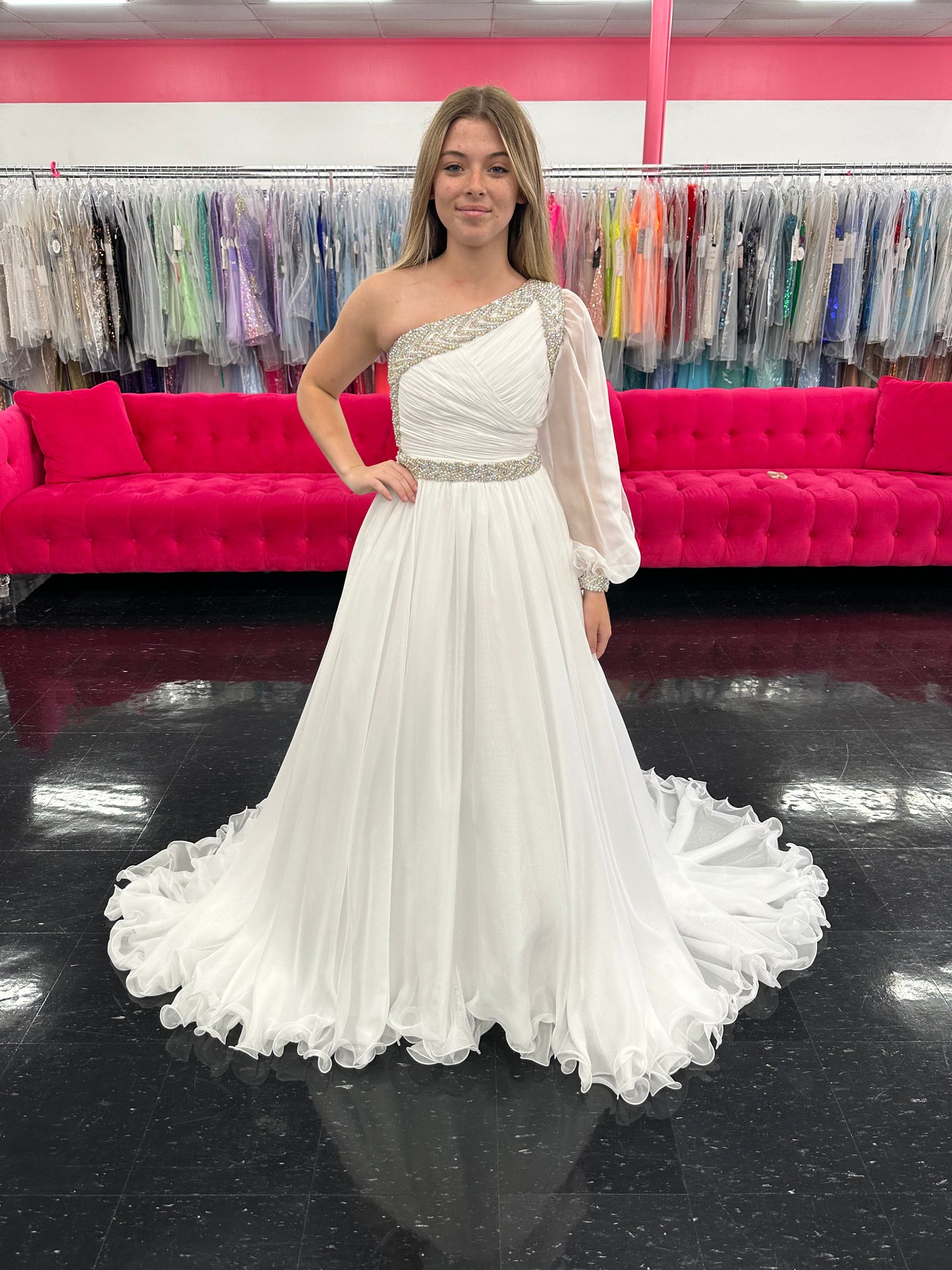 Be the epitome of grace and elegance in the Samantha Blake 1014 one shoulder Long Sleeve Pageant Dress. Made with delicate chiffon and a stunning crystal embellished bodice, this dress features a one-shoulder design and long sleeves for a sophisticated look. Perfect for any pageant or formal event.