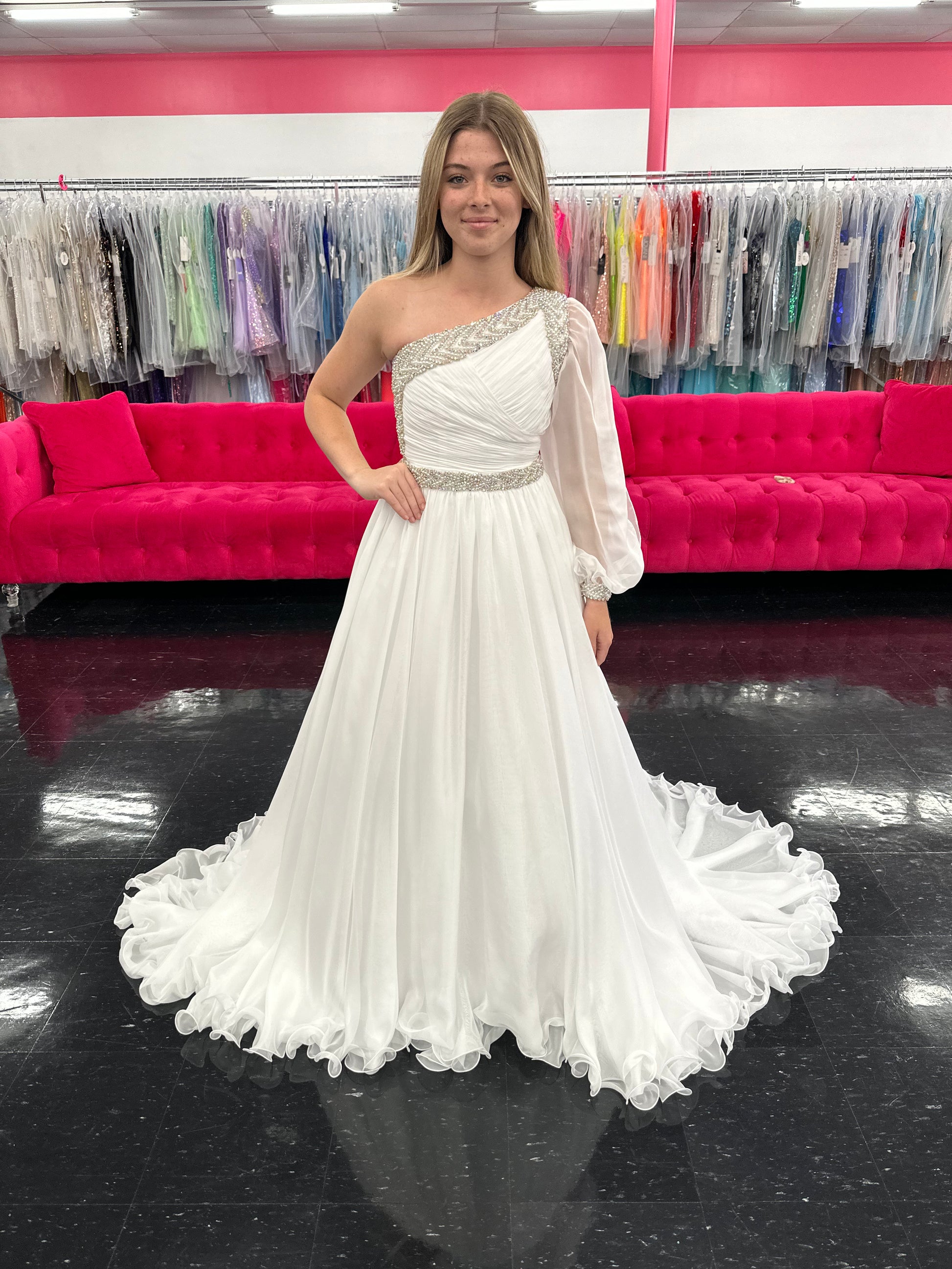 Be the epitome of grace and elegance in the Samantha Blake 1014 one shoulder Long Sleeve Pageant Dress. Made with delicate chiffon and a stunning crystal embellished bodice, this dress features a one-shoulder design and long sleeves for a sophisticated look. Perfect for any pageant or formal event.