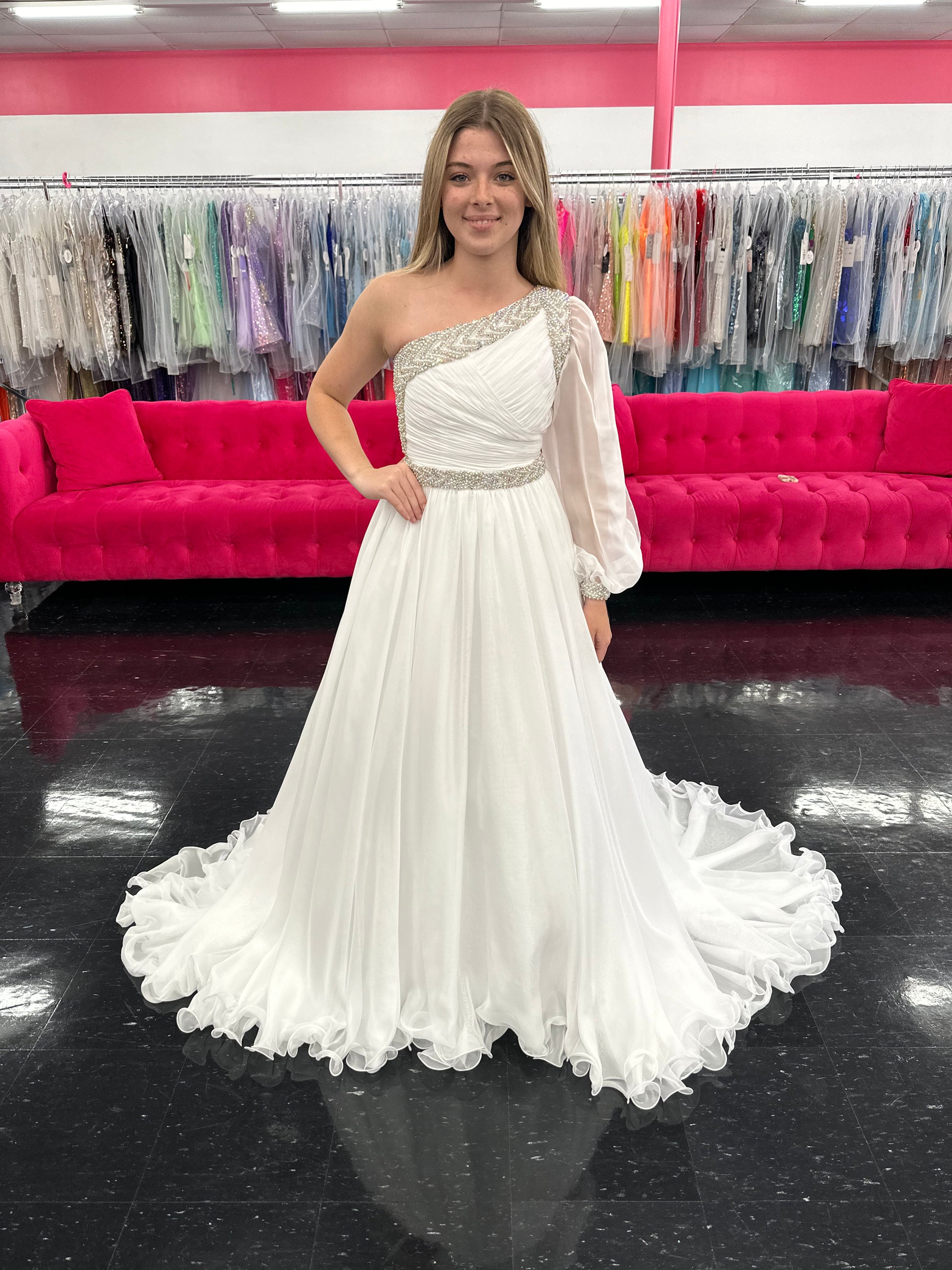 Be the epitome of grace and elegance in the Samantha Blake 1014 one shoulder Long Sleeve Pageant Dress. Made with delicate chiffon and a stunning crystal embellished bodice, this dress features a one-shoulder design and long sleeves for a sophisticated look. Perfect for any pageant or formal event.