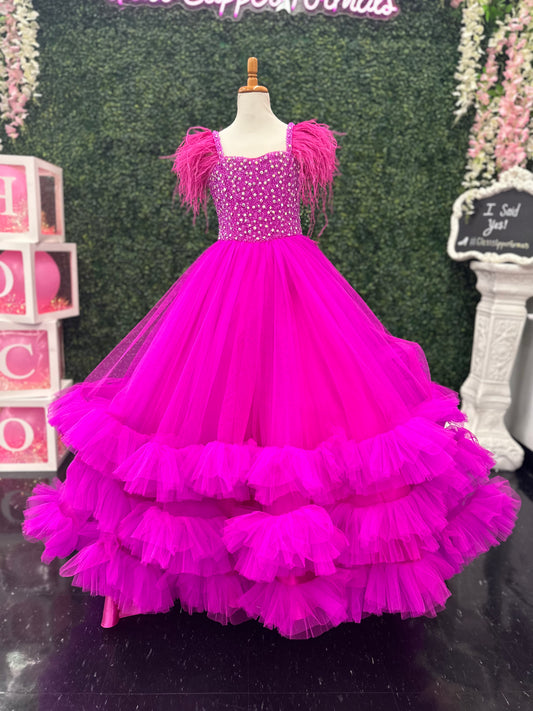 Sugar Kayne C327 features a fashionable pageant dress for girls and preteens, complete with feather straps, a tiered ruffle bottom, and a crystal stone bodice.&nbsp;Stand out and feel confident on stage! 