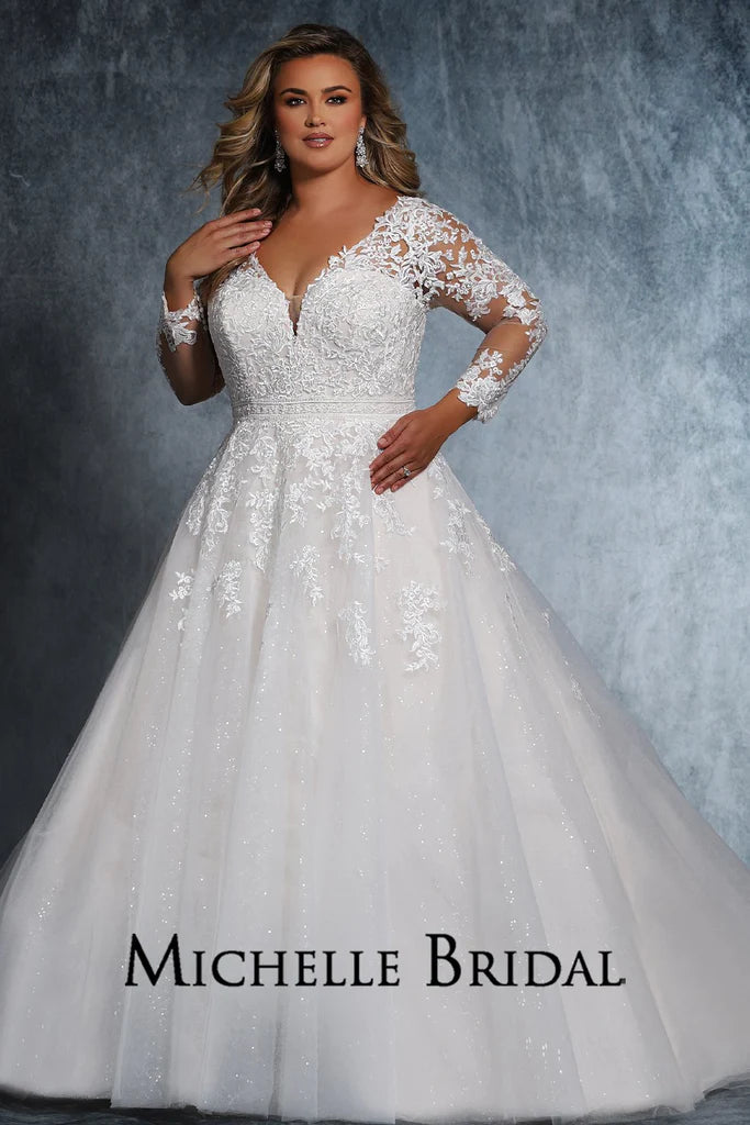 Michelle Bridal For Sydney's Closet MB2110 A-Line Long Sleeve Crystal Buttons Embroidered Floral Appliques V-Neck Plus Size "Cyndi" Bridal Gown. Look flawless in this full-length "Cyndi" bridal gown from Michelle Bridal for Sydney's Closet. This A-line dress features long sleeves, crystal buttons, embroidered floral appliques, and a V-neckline for a stunning profile. Plus size available for an impeccable fit.