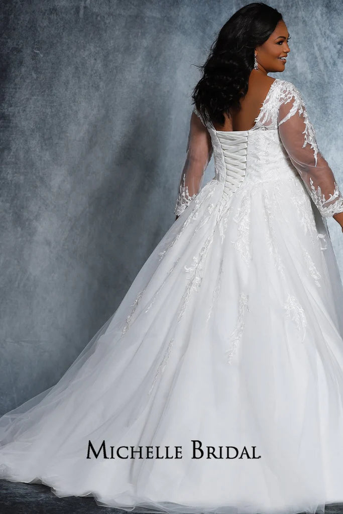 Experience elegance and luxury with this beautiful Michelle Bridal for Sydney's Closet MB2118 gown. It features a v-neck silhouette with long sleeves, embroidered lace appliques, and sequins for a truly unique look. Plus size and "Madonna" styles also available.