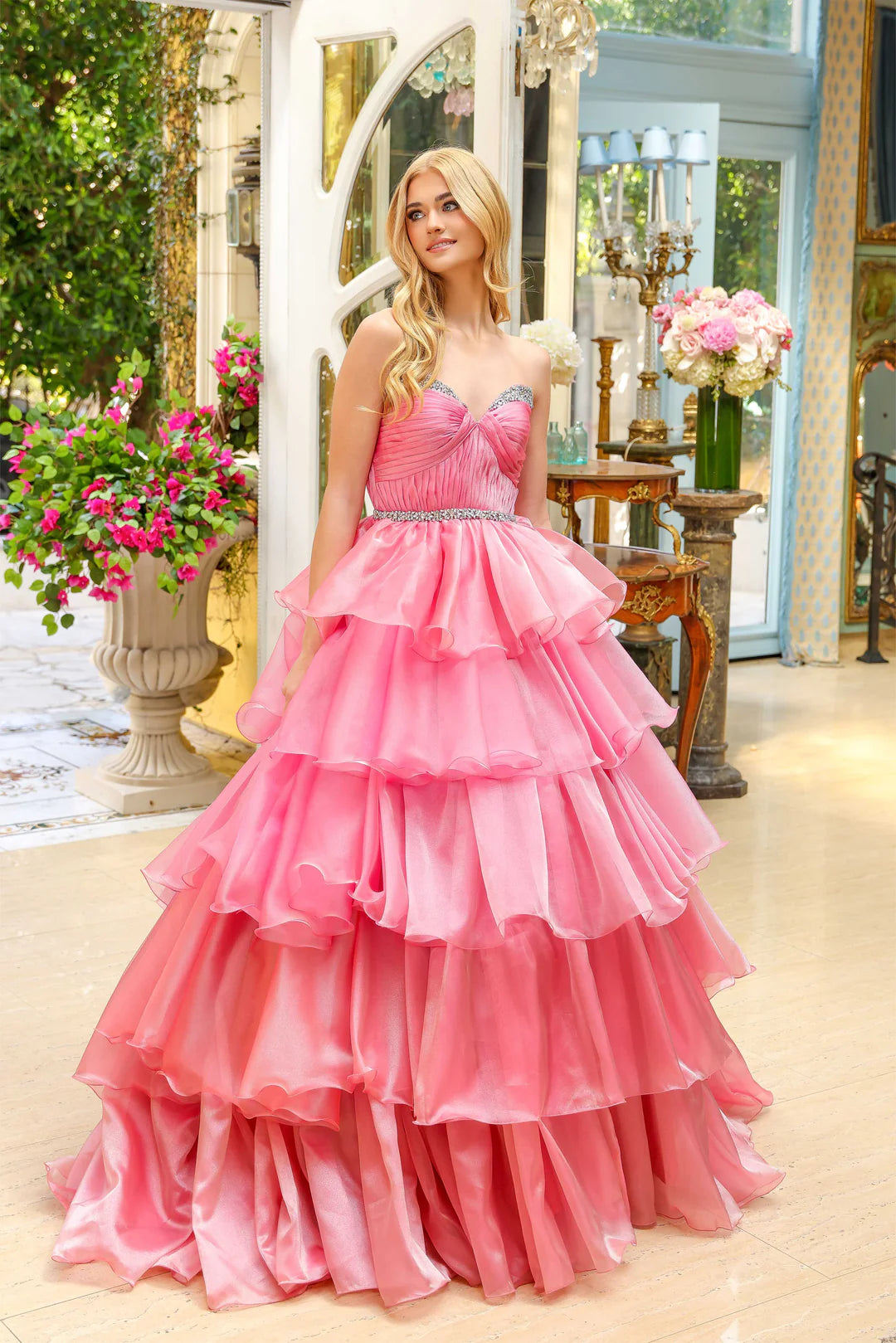 Indulge in luxury with the Ava Presley 29546 Long Layered Prom Dress. This stunning ballgown features a strapless A-line silhouette and sparkling crystal detailing. Perfect for prom or a pageant, this dress will make you feel like royalty. Step into elegance with the Ava Presley 29546