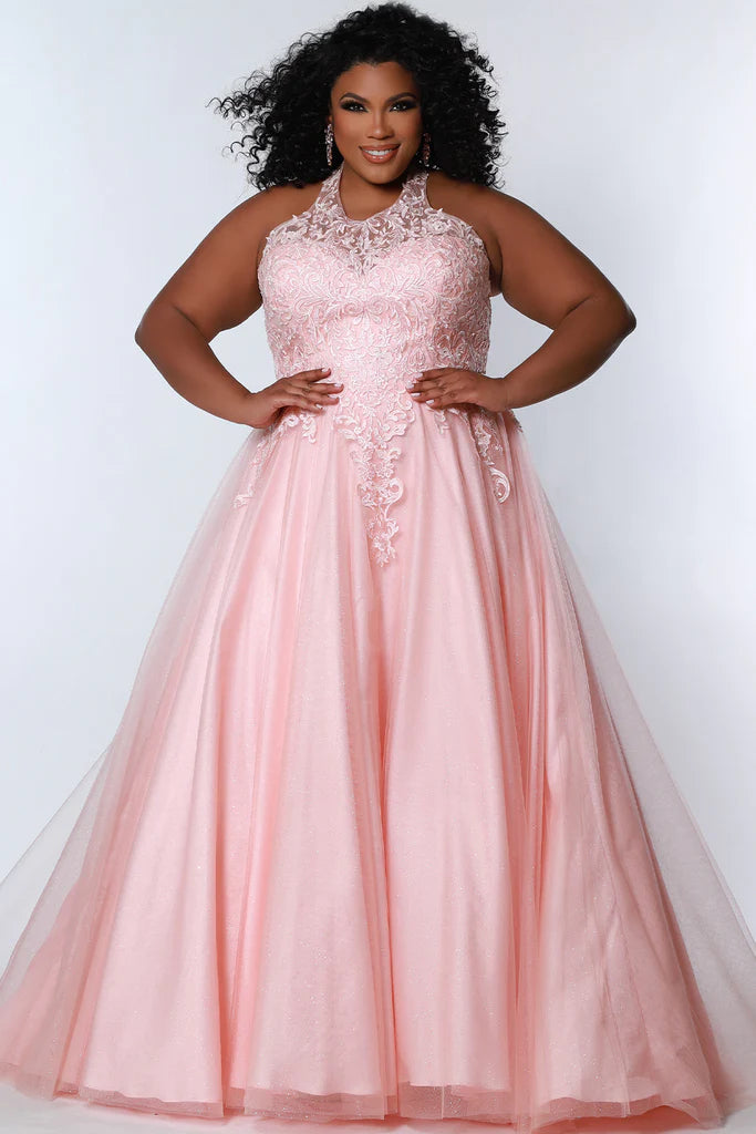 Sydney's Closet SC7352 A-Line Glitter Tulle Lace Appliques Lace Up Back Halter Neckline Plus Size Prom Dress. The Sydney's Closet SC7352 A-Line Glitter Tulle Lace Appliques Plus Size Prom Dress makes a glamorous addition to your wardrobe. This chic dress features an A-line silhouette, glitter tulle overlay, and delicate lace appliques - all crafted with an adjustable lace-up back and halter neckline. An elegant choice for formal occasions.